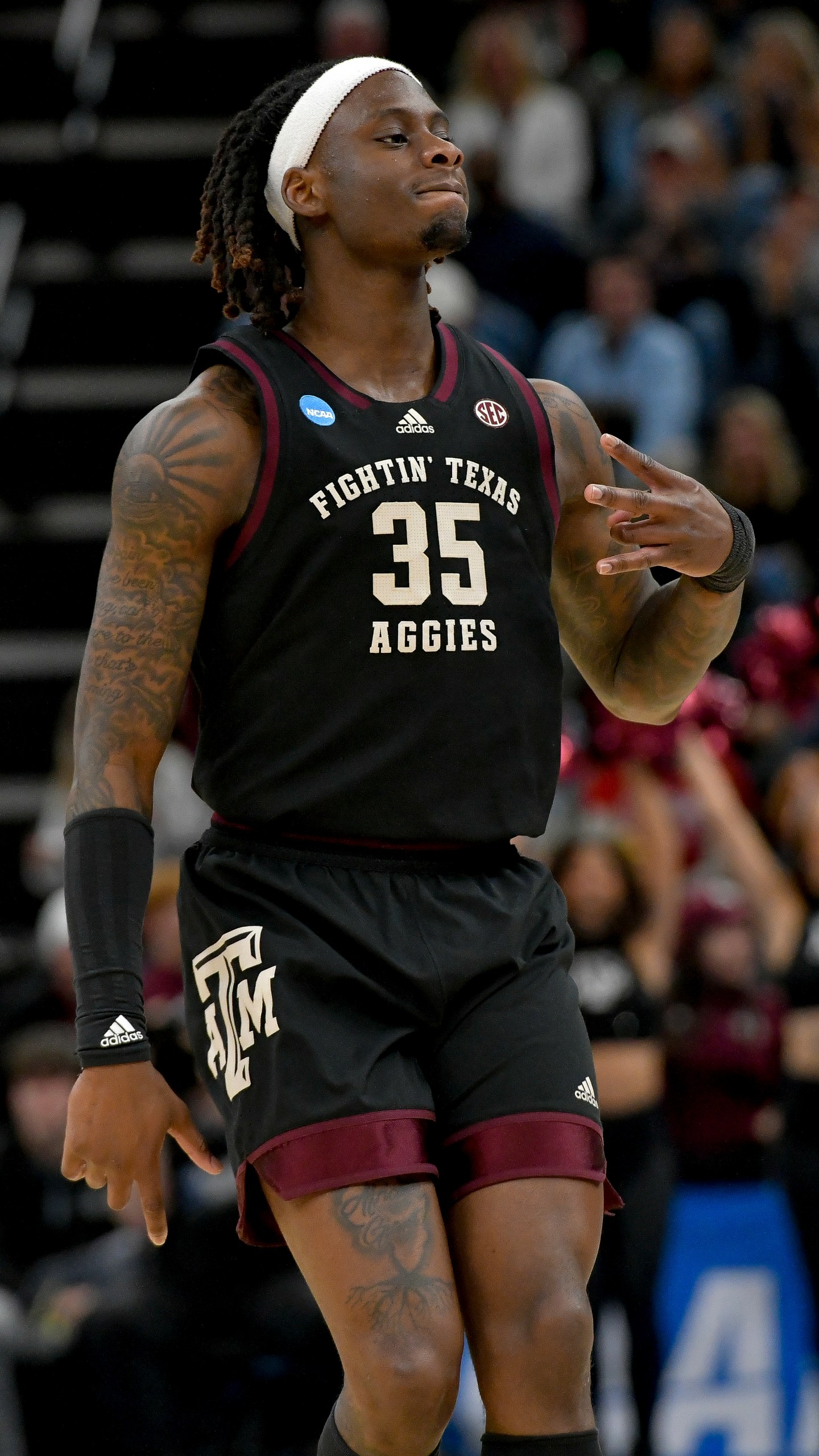 Texas A&M guard Manny Obaseki (35) celebrates a three-point basket against Houston during the first half of a second-round college basketball game in the NCAA Tournament, Sunday, March 24, 2024, in Memphis, Tenn. (AP Photo/Brandon Dill)