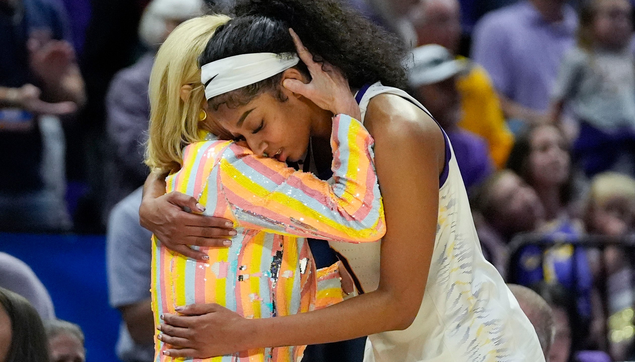 LSU head coach Kim Mulkey hugs forward Angel Reese late in the second half of a second-round college basketball game against Middle Tennessee in the women's NCAA Tournament in Baton Rouge, La., Sunday, March 24, 2024. LSU won 83-56. (AP Photo/Gerald Herbert)