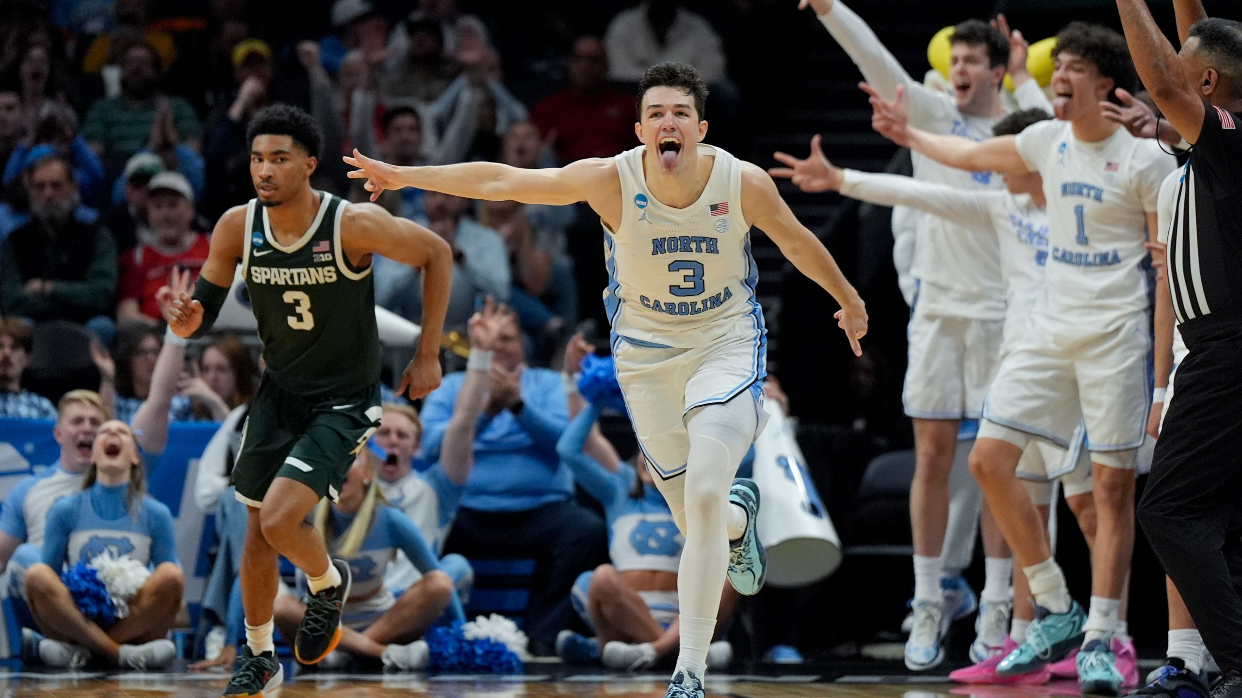 North Carolina guard Cormac Ryan (3) celebrates after scoring against Michigan State during the second half of a second-round college basketball game in the NCAA Tournament, Saturday, March 23, 2024, in Charlotte, N.C. (AP Photo/Chris Carlson)