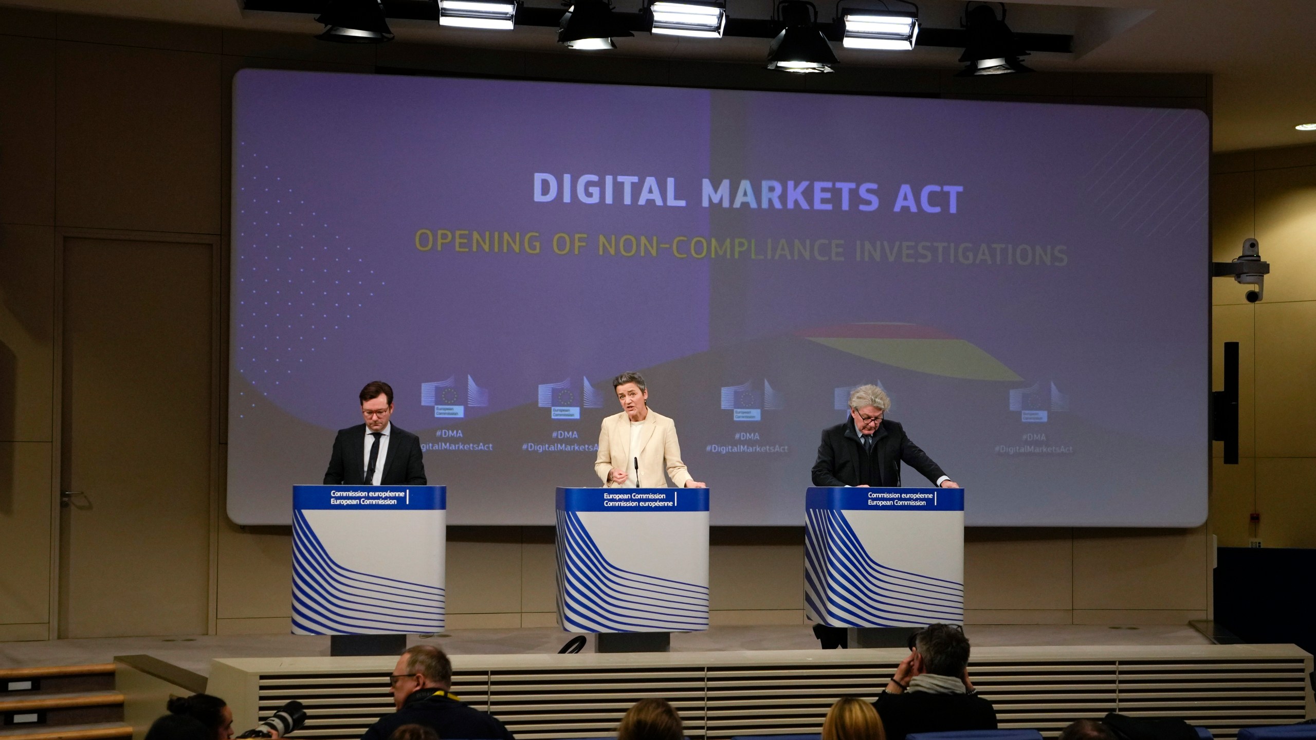 European Commissioner for Europe fit for the Digital Age Margrethe Vestager, center, and European Commissioner for Internal Market Thierry Breton, right, address a media conference regarding the Digital Markets Act at EU headquarters in Brussels, Monday, March 25, 2024. The European Commission on Monday opened non-compliance investigations against Alphabet, Apple and Meta under the Digital Markets Act. (AP Photo/Virginia Mayo)