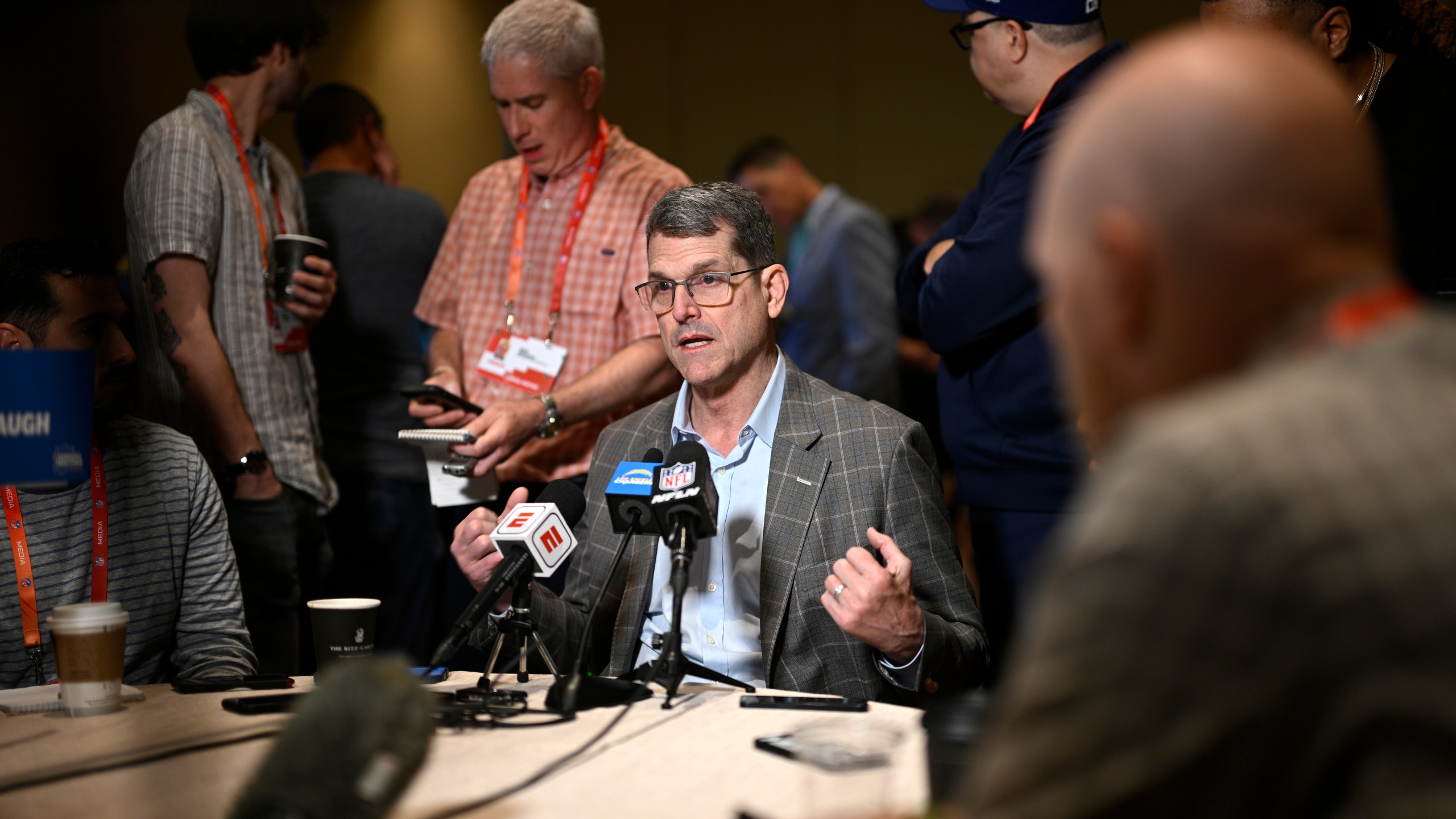 Los Angeles Chargers head coach Jim Harbaugh talks with reporters during an AFC coaches availability at the NFL owners meetings, Monday, March 25, 2024, in Orlando, Fla. (AP Photo/Phelan M. Ebenhack)