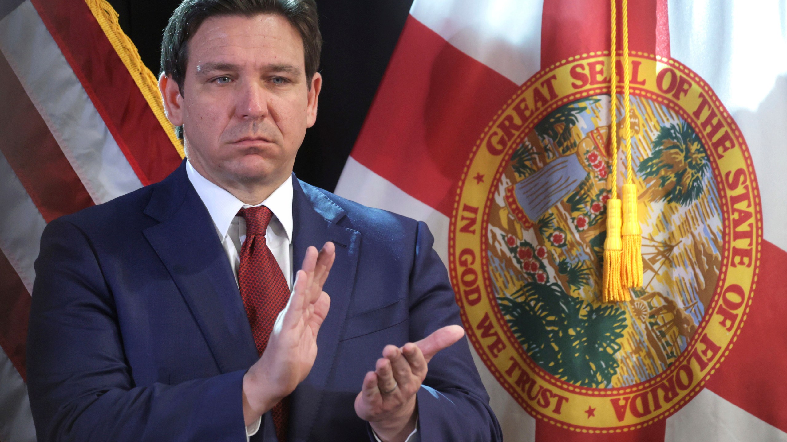 FILE 0 Florida Gov. Ron DeSantis applauds during a press conference at the Central Florida Tourism Oversight District headquarters at Walt Disney World, in Lake Buena Vista, Fla., Thursday, Feb. 22, 2024. Florida will have one of the country's most restrictive social media bans for minors — if it withstands expected legal challenges — under a bill signed by Republican Florida Gov. Ron DeSantis on Monday, March 25, 2024. (Joe Burbank/Orlando Sentinel via AP, File)