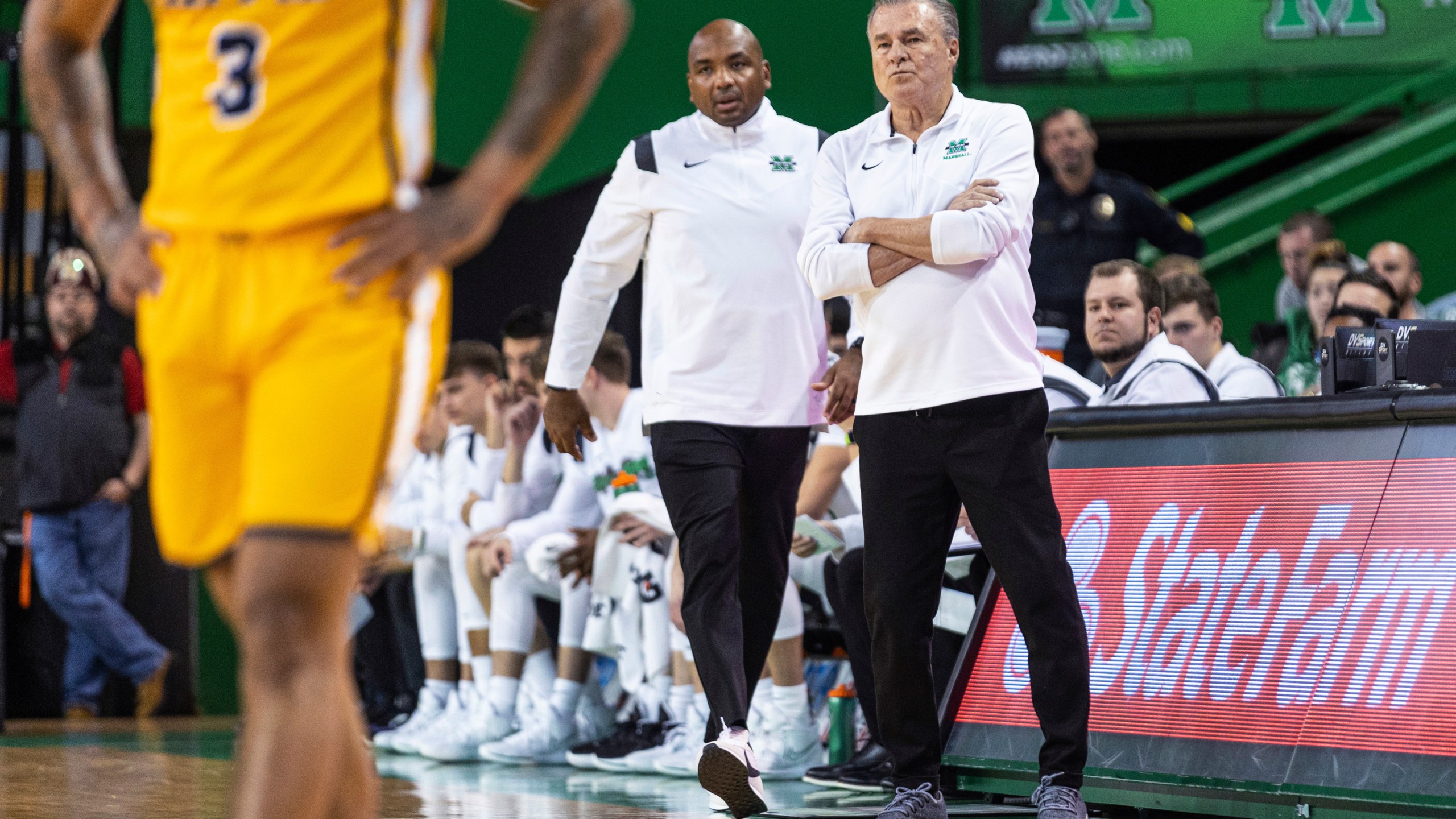 FILE - Marshall coach Dan D'Antoni, right, and assistant coach Cornelius Jackson talk on the sideline during the team's NCAA college basketball game against Coppin State, Nov. 19, 2022, in Huntington, W.Va. Jackson was named Monday, March 25, 2024, to replace D’Antoni as Marshall's head coach. (Sholten Singer/The Herald-Dispatch via AP, File)