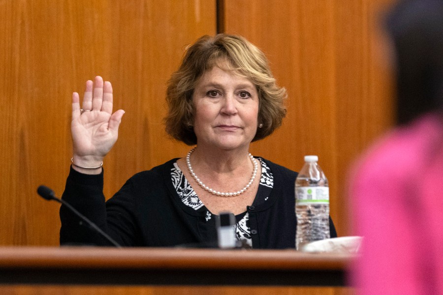 FILE- Colleton County Clerk of Court Rebecca Hill is sworn in before taking the stand to testify during the Alex Murdaugh jury-tampering hearing at the Richland County Judicial Center, Monday, Jan. 29, 2024, in Columbia, S.C. Hill, under investigation amid allegations of tampering with the jury in the Alex Murdaugh trial, announced her resignation on Monday, March 25, 2024. (Andrew J. Whitaker/The Post And Courier via AP, Pool, File)