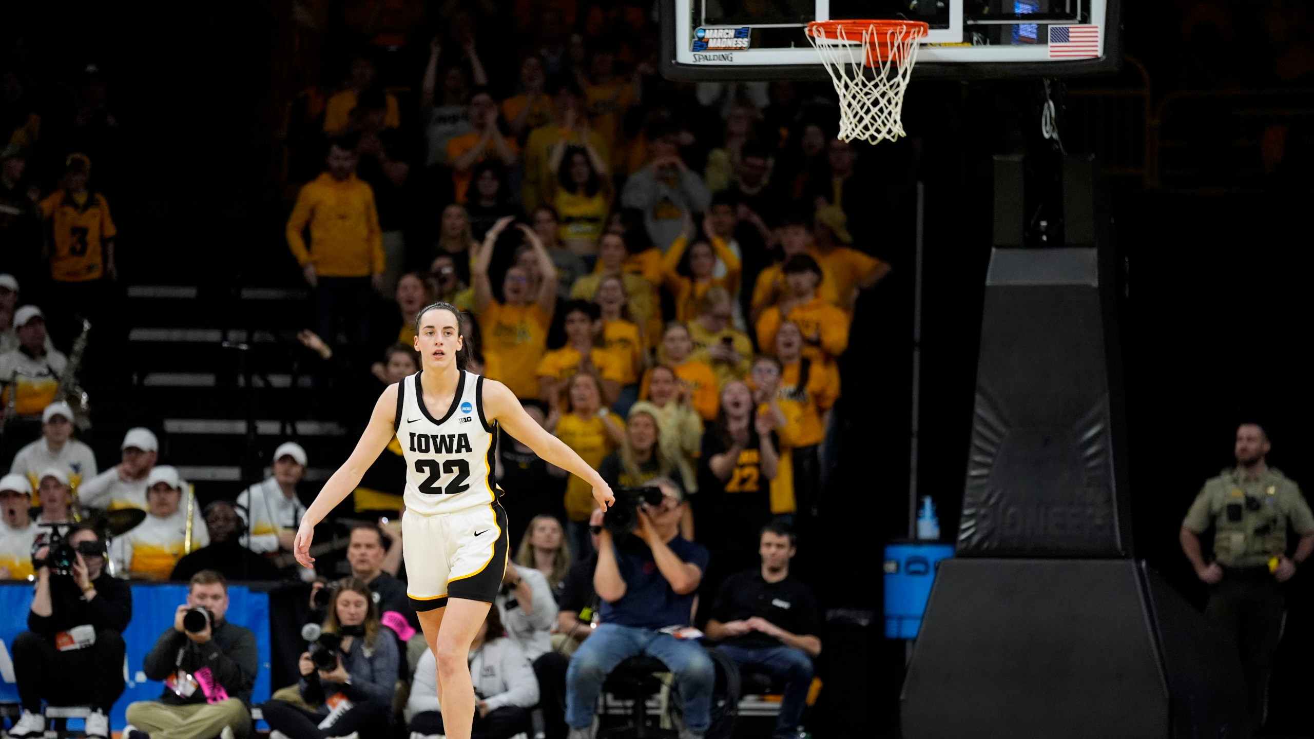 Iowa guard Caitlin Clark (22) reacts after making a three-point basket in the second half of a second-round college basketball game against West Virginia in the NCAA Tournament, Monday, March 25, 2024, in Iowa City, Iowa. (AP Photo/Charlie Neibergall)
