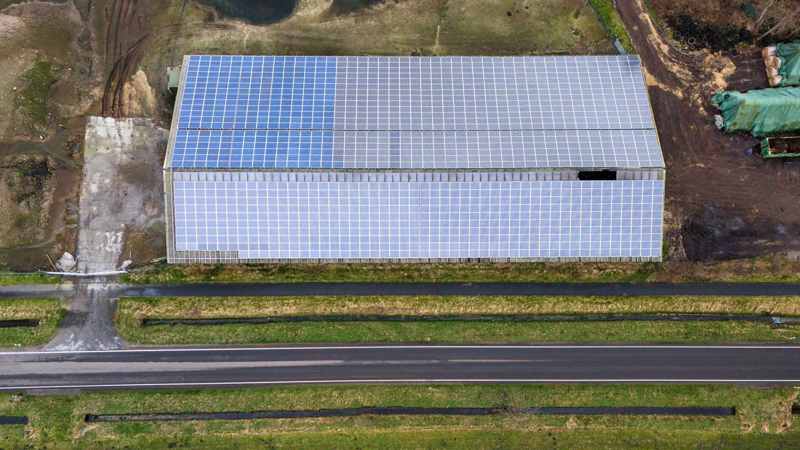 A photovoltaic system is installed on a building in Sprakebuell, Germany, Thursday, March 14, 2024. Sprakebuell is something of a model village for the energy transition - with an above-average number of electric cars, a community wind farm and renewable heat from biogas. All houses in the village center have been connected to the local heating network and all old oil heating systems have been removed. (AP Photo/Frank Molter)