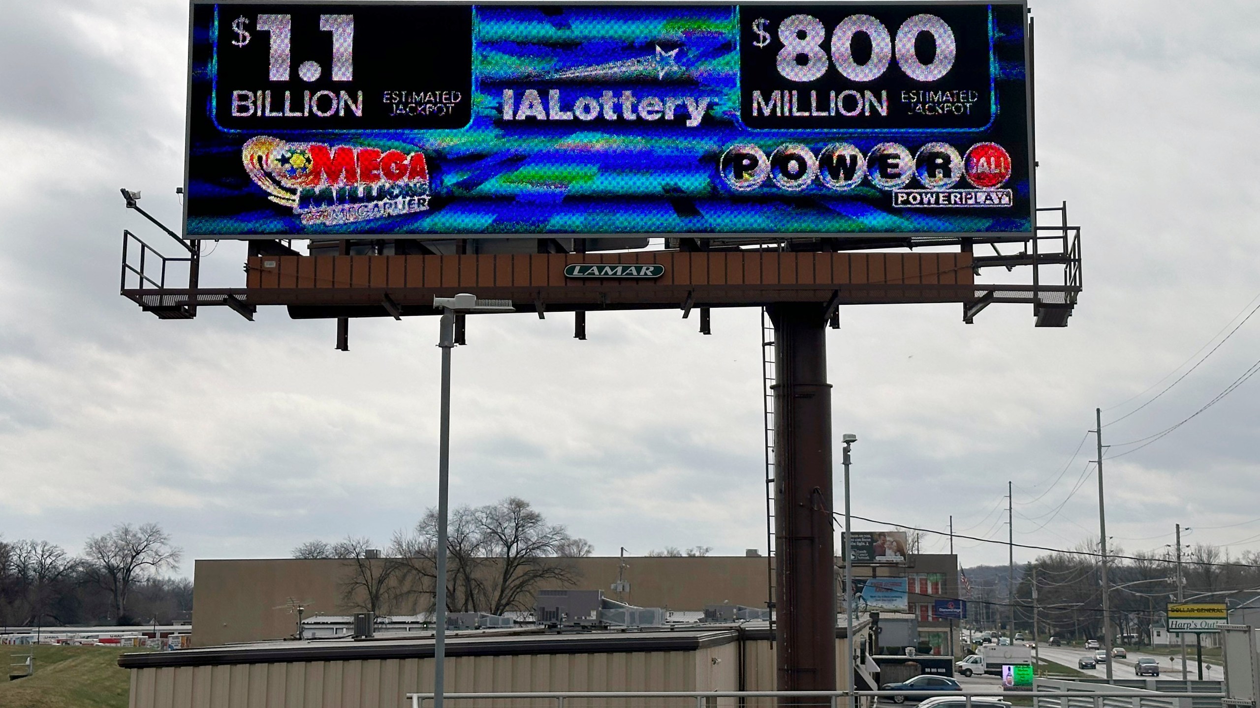 An electronic billboard advertises the Mega Millions and Powerball jackpots, Monday, March 25, 2024, in in Des Moines, Iowa, that when combined amount to nearly $2 billion. It's the first time the two lottery games each have jackpots of $800 million or more. (AP Photo/Scott McFetridge)