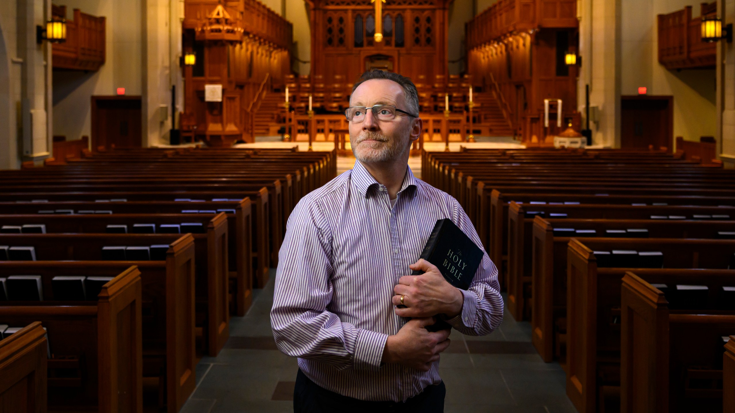 Chaplain of The Covenant School Matthew Sullivan stands in the school's church sanctuary where he lead chapel service in the past, Friday, March 22, 2024, in Nashville, Tenn. Facing the first anniversary of a tragic shooting which left six people dead, the school, which has been meeting in a temporary location, prepares to move back into the building where it happened. (AP Photo/John Amis)