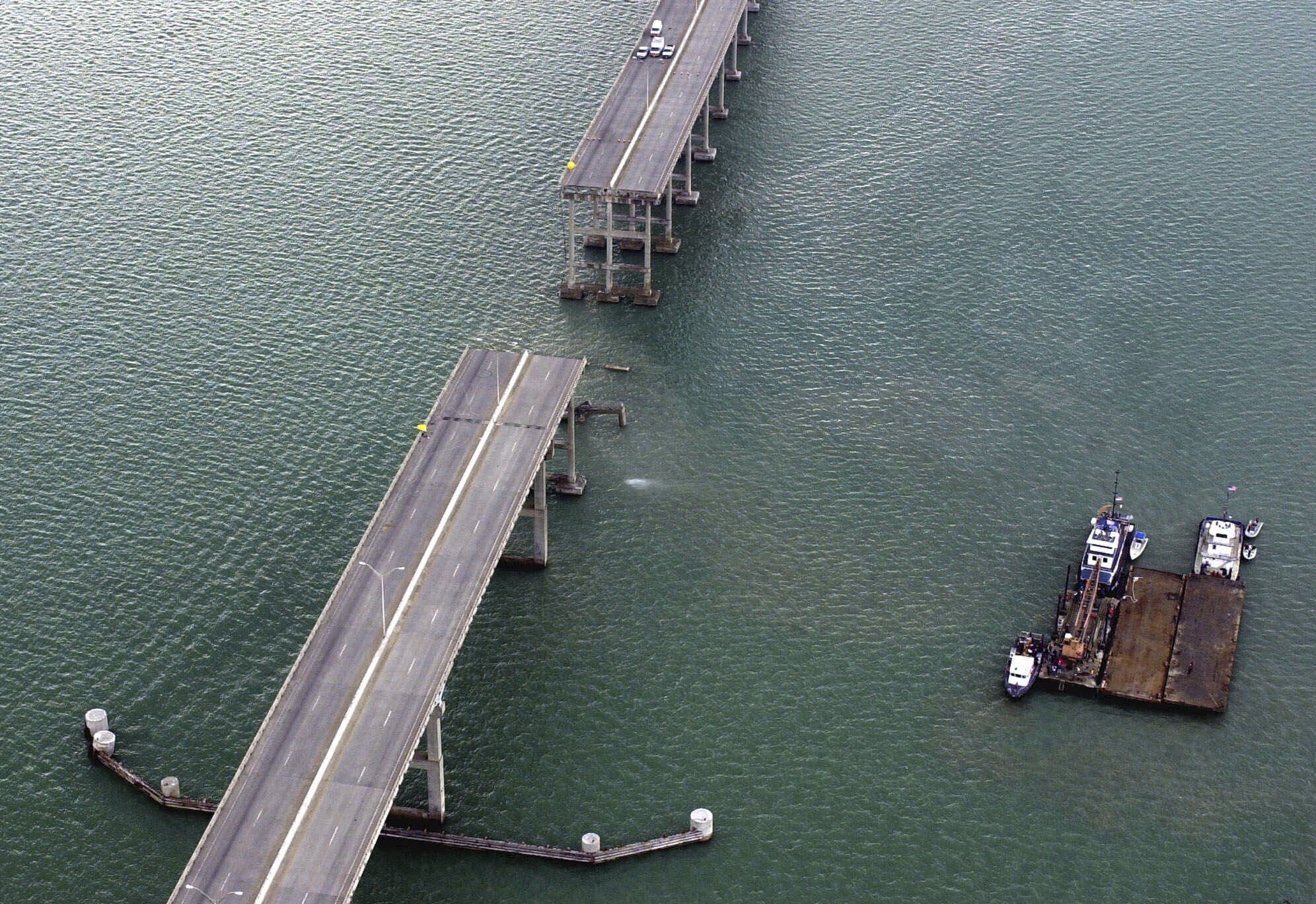 FILE - A section of the Queen Isabella Causeway is shown missing as crews break from their search and rescue due to a stormm in Port Isabella, Texas on Saturday, Sept. 15, 2001. A container ship struck a major bridge in Baltimore early Tuesday, March 26, 2024, causing it to plunge into the river below. From 1960 to 2015, there have been 35 major bridge collapses worldwide due to ship or barge collision (AP Photo/Eric Gay, File)