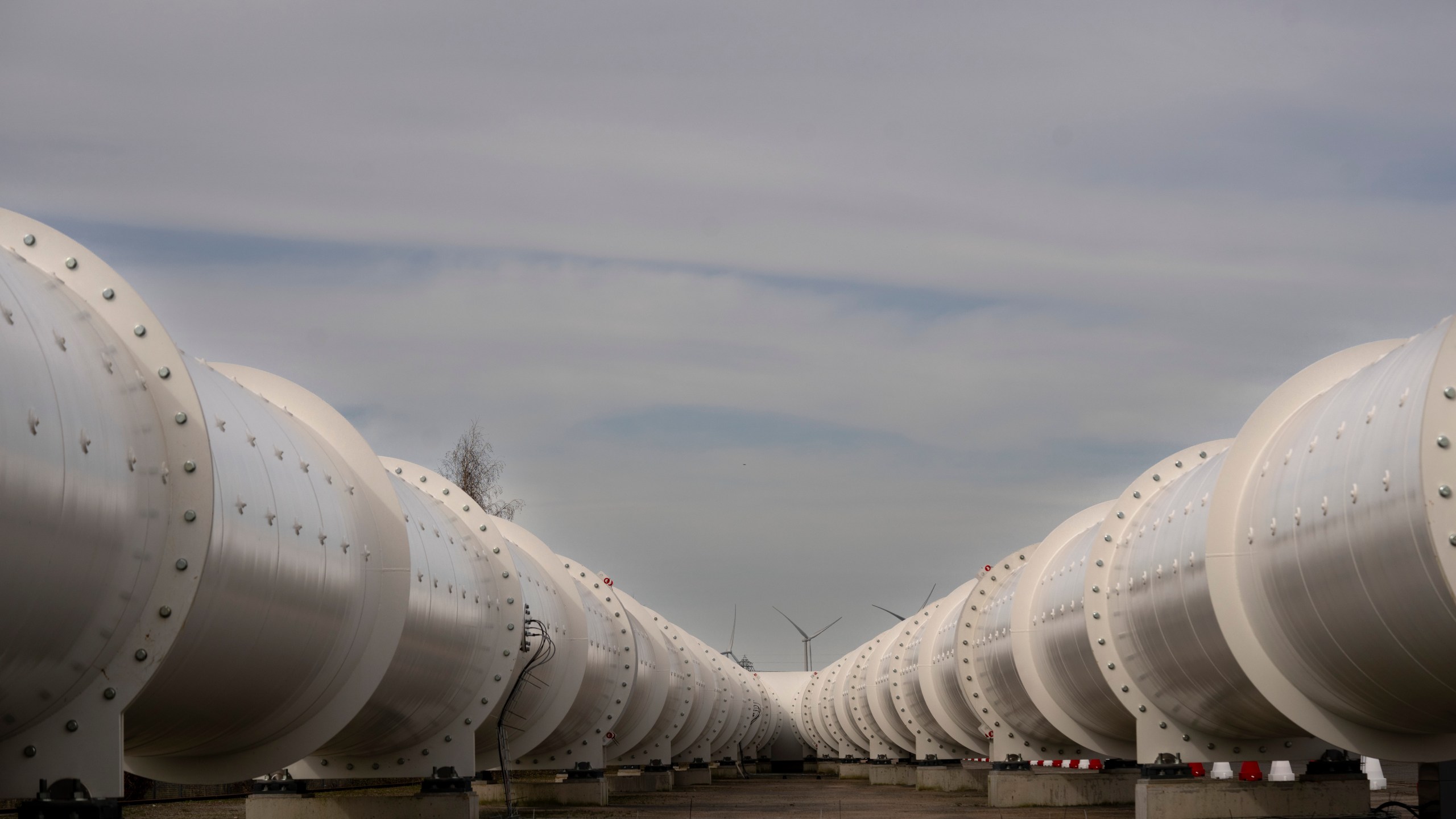 The split in a hyperloop tube allows vehicles to change directions at a test facility of new European test center for hyperloop transportation technology which opens in Veendam, northern Netherlands, Tuesday, March 26, 2024. (AP Photo/Peter Dejong)