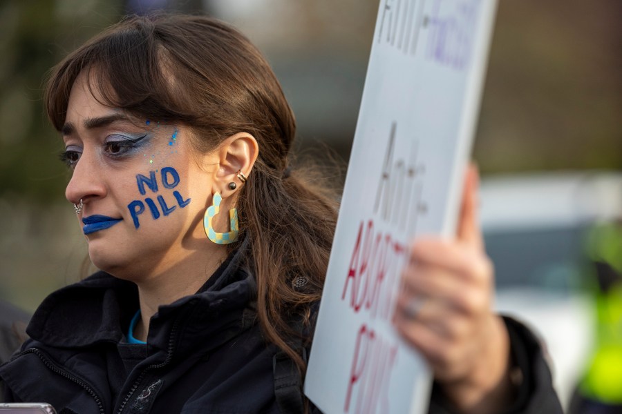 Anti-abortion activist Elise Ketch wears face paint outside the Supreme Court, Tuesday, March 26, 2024, in Washington. The Supreme Court is hearing arguments in its first abortion case since conservative justices overturned the constitutional right to an abortion two years ago. At stake in Tuesday's arguments is the ease of access to a medication used last year in nearly two-thirds of U.S. abortions. (AP Photo/Amanda Andrade-Rhoades)