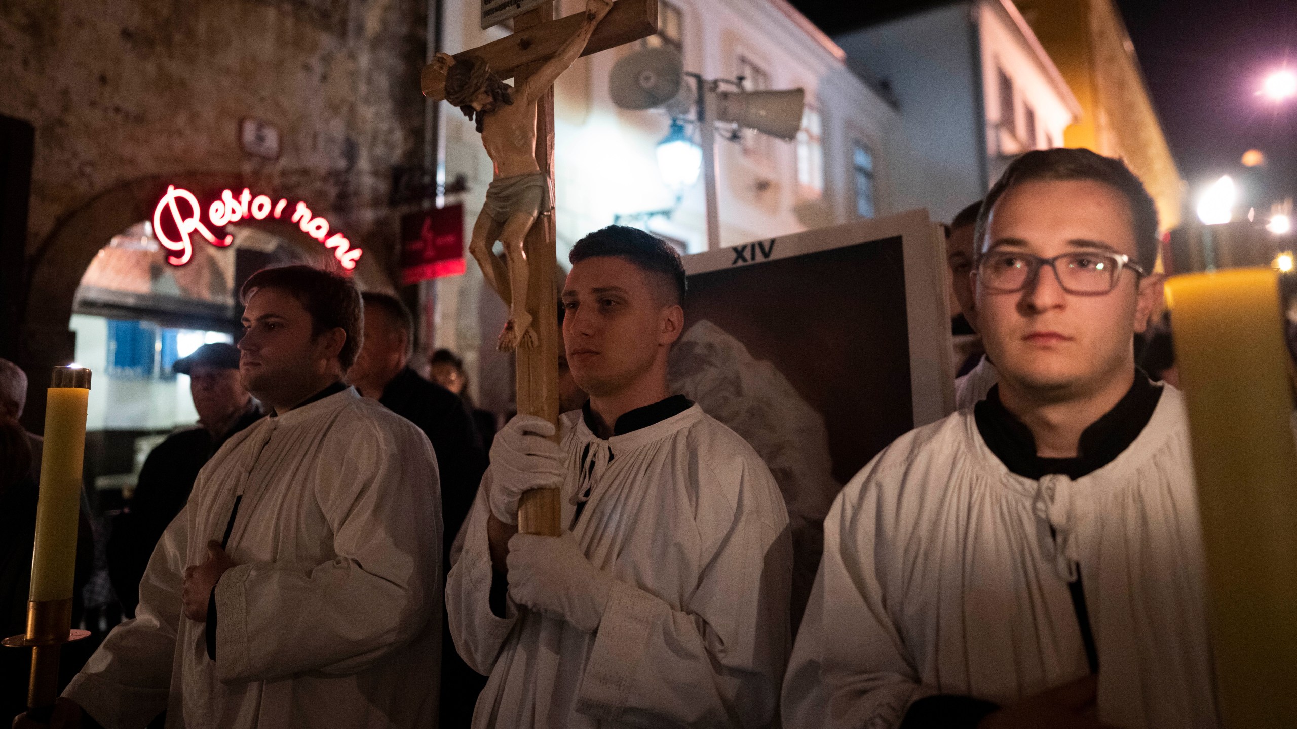 Men wearing altar-boy robes take part in a pro-life march in Zagreb, Croatia, Friday, March 15, 2024. Scores of religious and neo-conservative groups in recent years have been building up pressure in the staunchly Catholic country, trying to force a ban on abortions. (AP Photo/Darko Bandic)