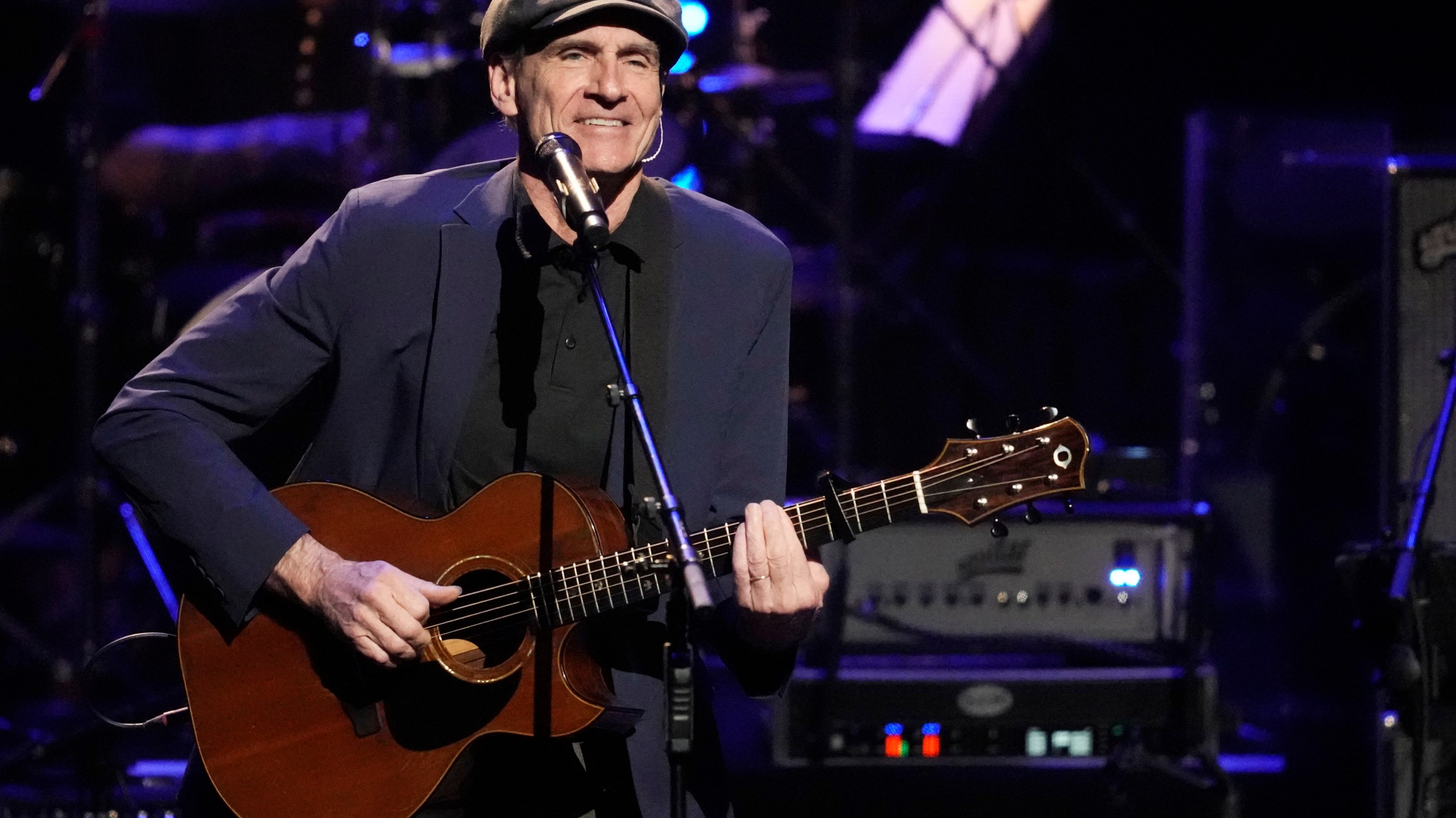 FILE - James Taylor performs at the 7th annual Love Rocks NYC concert in New York on March 9, 2023. Taylor kicks off his North American tour on May 29 at the Hollywood Bowl in Los Angeles. (Photo by Charles Sykes/Invision/AP, File)