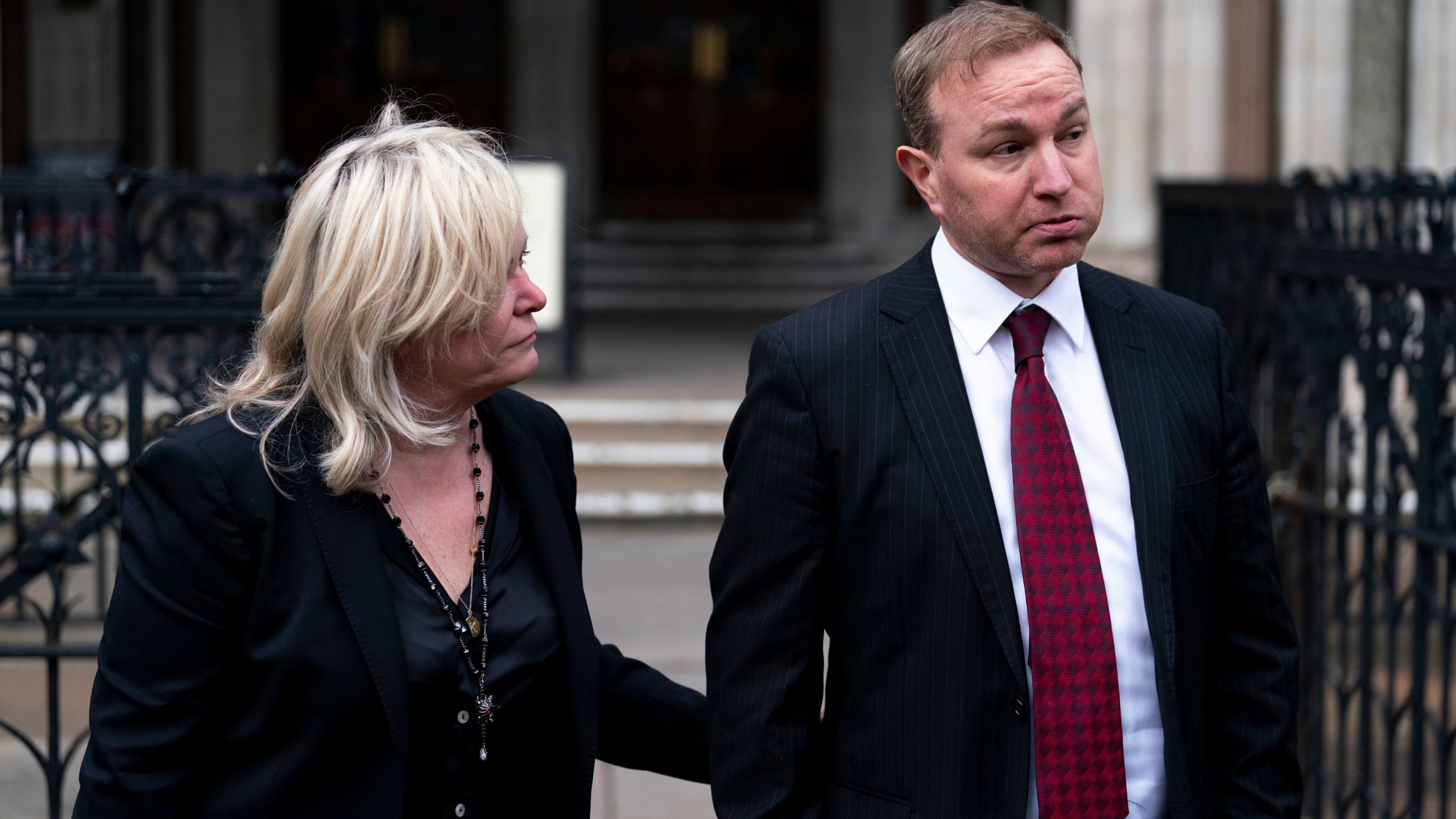 Financial market trader Tom Hayes walks with his lawyer Karen Todner, left, outside the Royal Courts Of Justice in London after two former financial market traders convicted of interest rate benchmark manipulation have had bids to clear their names rejected by the Court of Appeal, on Wednesday March 27, 2024. Tom Hayes, 44, a former Citigroup and UBS trader, was found guilty of multiple counts of conspiracy to defraud over manipulating the London Inter-Bank Offered Rate (Libor) between 2006 and 2010. His case, alongside that of another similarly jailed trader Carlo Palombo, 45, were referred to the court by the Criminal Cases Review Commission (CCRC), which investigates potential miscarriages of justice. (Jordan Pettitt/PA via AP)