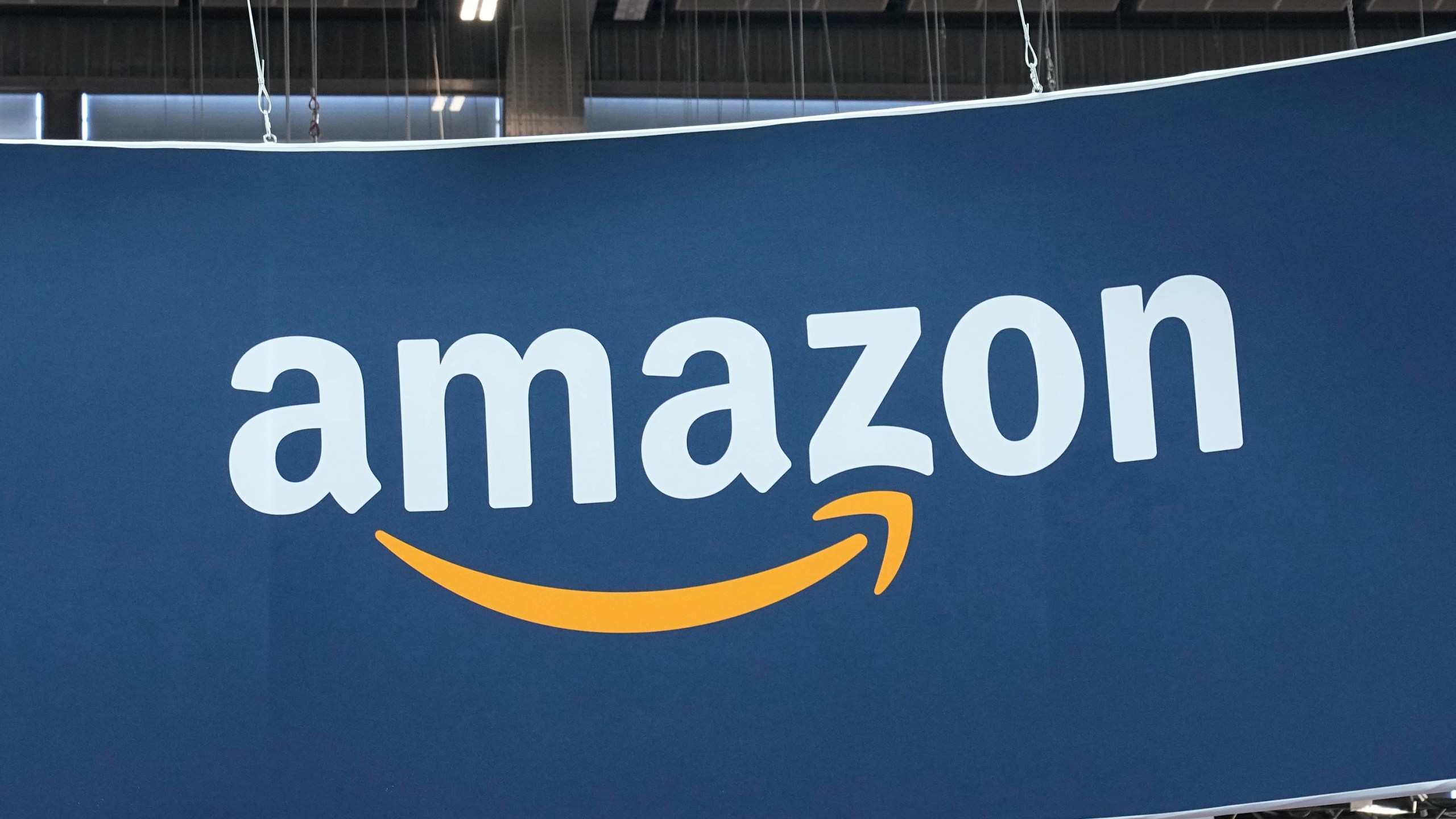 FILE - The Amazon logo is photographed at the Vivatech show in Paris, on June 15, 2023. Amazon says, Wednesday, March 27, 2024, its investing another $2.75 billion in the Artificial intelligence startup Anthropic, bringing its total investment in the company to $4 billion. The investment will give Amazon a minority stake in San Francisco-based Anthropic, which is a rival to OpenAI, the maker of the popular chatbot ChatGPT. (AP Photo/Michel Euler, File)