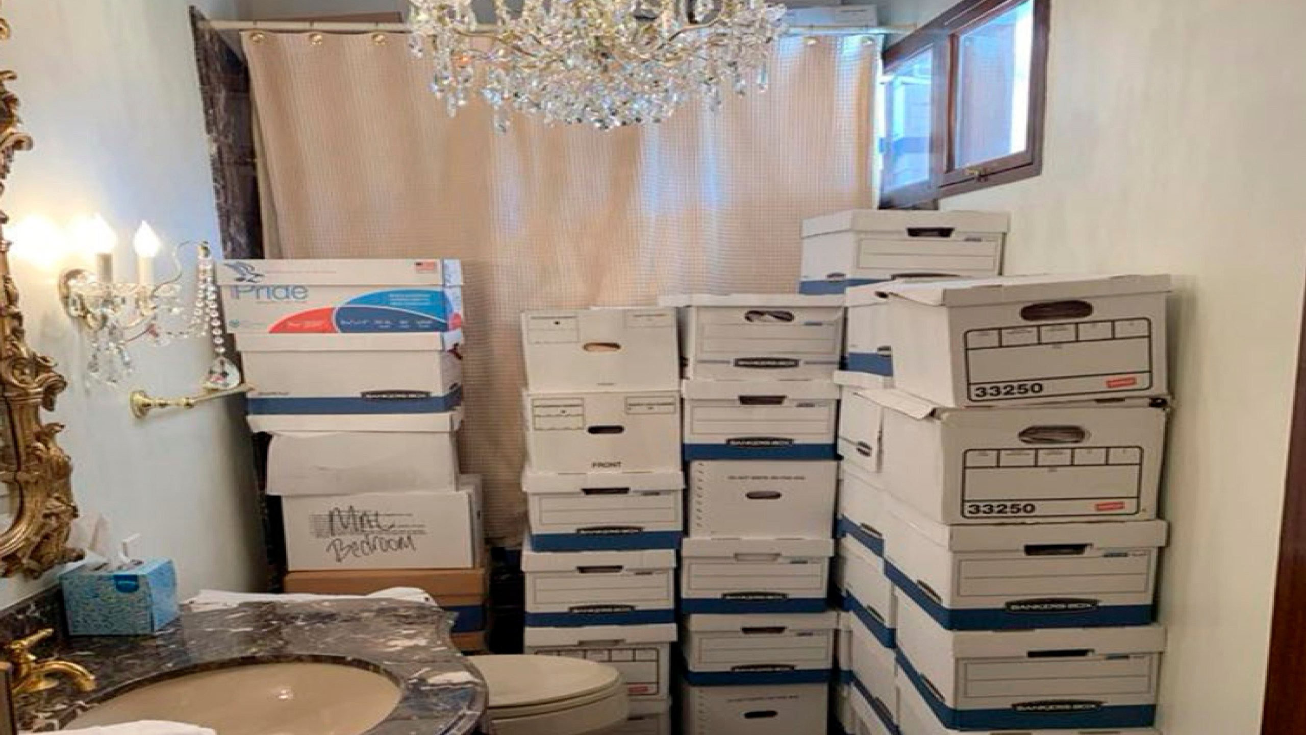 This image, contained in the indictment against former President Donald Trump, shows boxes of records stored in a bathroom and shower in the Lake Room at Trump's Mar-a-Lago estate in Palm Beach, Fla. The classified documents investigation of Donald Trump appeared to have clear momentum in 2022 when FBI agents who searched the former president’s Mar-a-Lago estate recovered dozens of boxes containing sensitive documents. But each passing day brings mounting doubts that the case can reach trial this year. The judge has yet to set a firm trial date despite holding two hours-long hearings with lawyers this month. (Justice Department via AP)