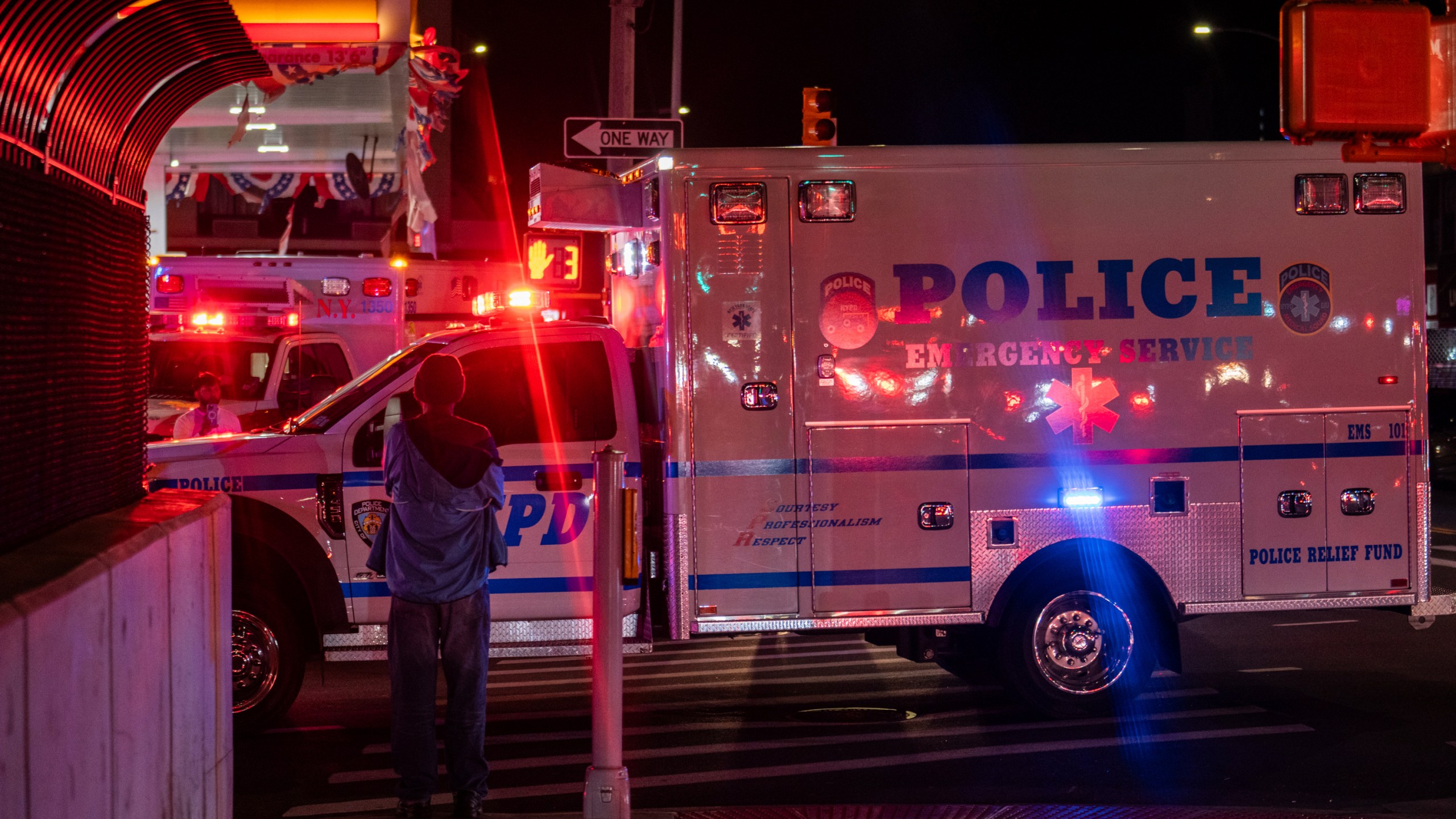 A New York City Police Department ambulance carrying the remains of Officer Jonathan Diller drives out from under Jamaica Hospital Medical Center in New York, late Monday, March 25, 2024. Diller was shot and killed during a traffic stop, Mayor Eric Adams said. (AP Photo/Jeenah Moon)