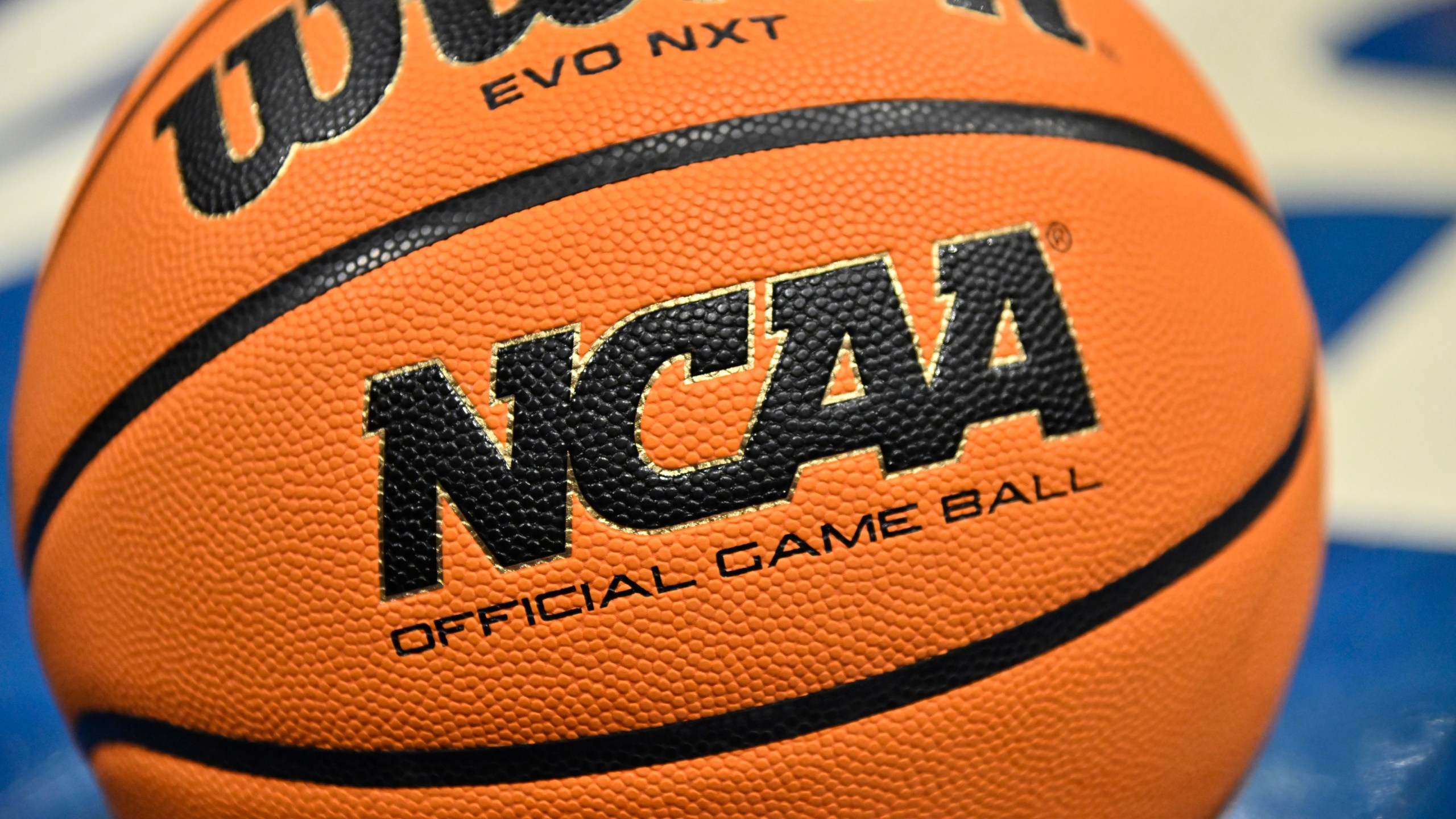 FILE - An official game ball sits on the court during the second half of an NCAA college basketball game between Southern California and UCLA in the semifinals of the Pac-12 tournament Friday, March 8, 2024, in Las Vegas. NCAA President Charlie Baker on Wednesday, March 26, urged lawmakers in states with legal wagering on sporting events to ban betting on individual player performances.(AP Photo/David Becker, File)