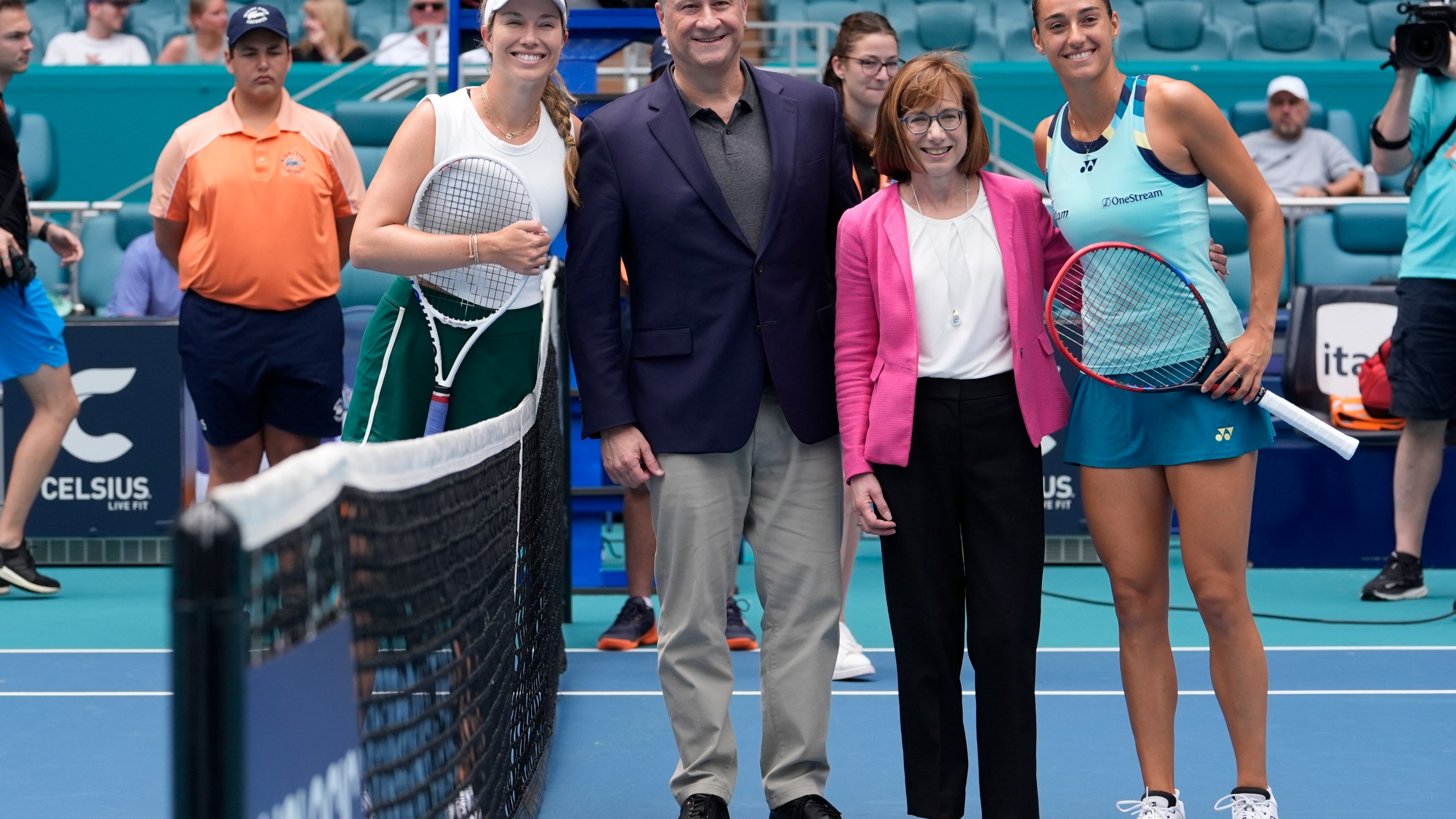 Second Gentleman Douglas Emhoff, center, poses with Danielle Collins, left, and Caroline Garcia, of France, right, before their match during the Miami Open tennis tournament, Wednesday, March 27, 2024, in Miami Gardens, Fla. Second from right is Cindy Long, administrator with the USDA. (AP Photo/Lynne Sladky)