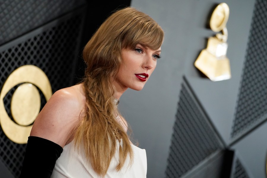 FILE - Taylor Swift arrives at the 66th annual Grammy Awards on Feb. 4, 2024, in Los Angeles. A photographer told police he was punched in the face by Taylor Swift’s father on the Sydney waterfront on Tuesday, Feb. 27, 2024, hours after the pop star’s Australian tour ended. (Photo by Jordan Strauss/Invision/AP, File)