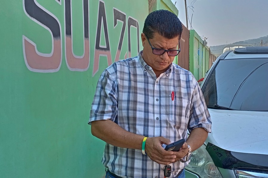 Martin Suazo Sandoval, the brother of Honduran citizen Maynor Yassir Suazo Sandoval, stands outside his home where he speaks with the press in Azacualpa, Honduras, Wednesday, March 27, 2024. Martin says that his brother Maynor is one of the missing people who was part of a maintenance crew on the bridge in Baltimore that collapsed. (AP Photo/Claudio Escalón)