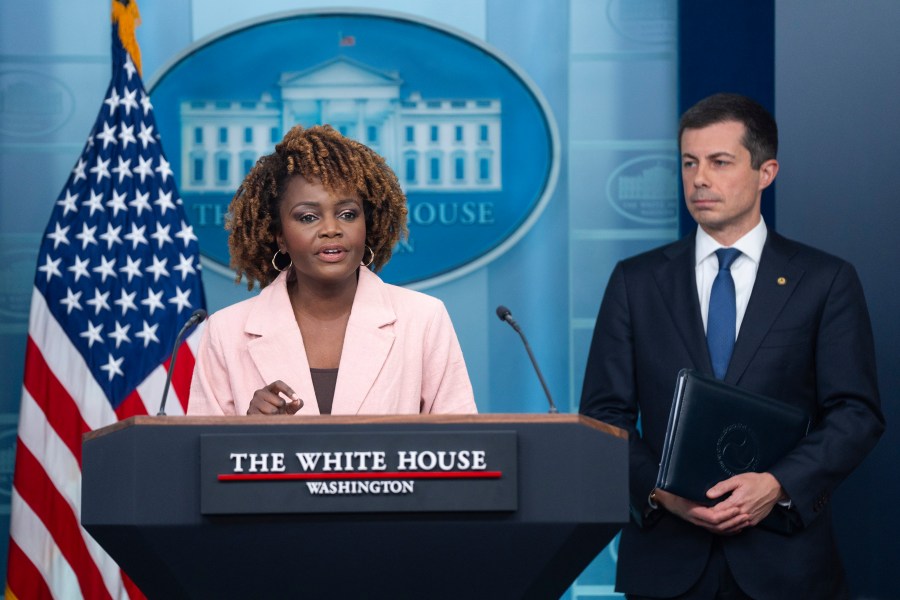 Transportation Secretary Pete Buttigieg listens as White House press secretary Karine Jean-Pierre speaks about the Francis Scott Key Bridge collapse during a press briefing at the White House, Wednesday, March 27, 2024, in Washington. (AP Photo/Evan Vucci)