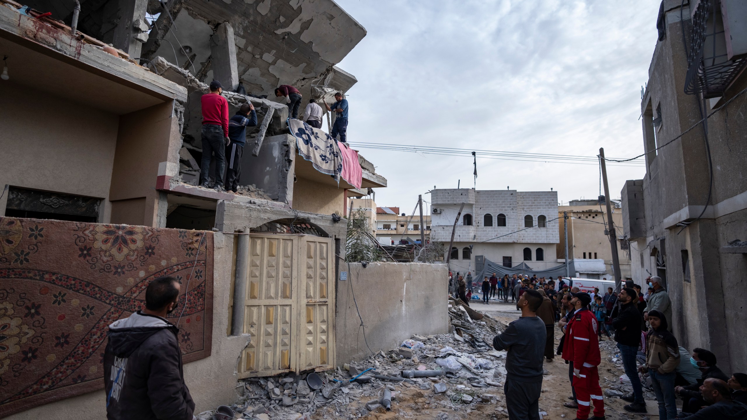 Palestinians search for bodies at a house hit by an Israeli strike in Rafah, Gaza Strip on Wednesday, March 27, 2024. (AP Photo/Fatima Shbair)