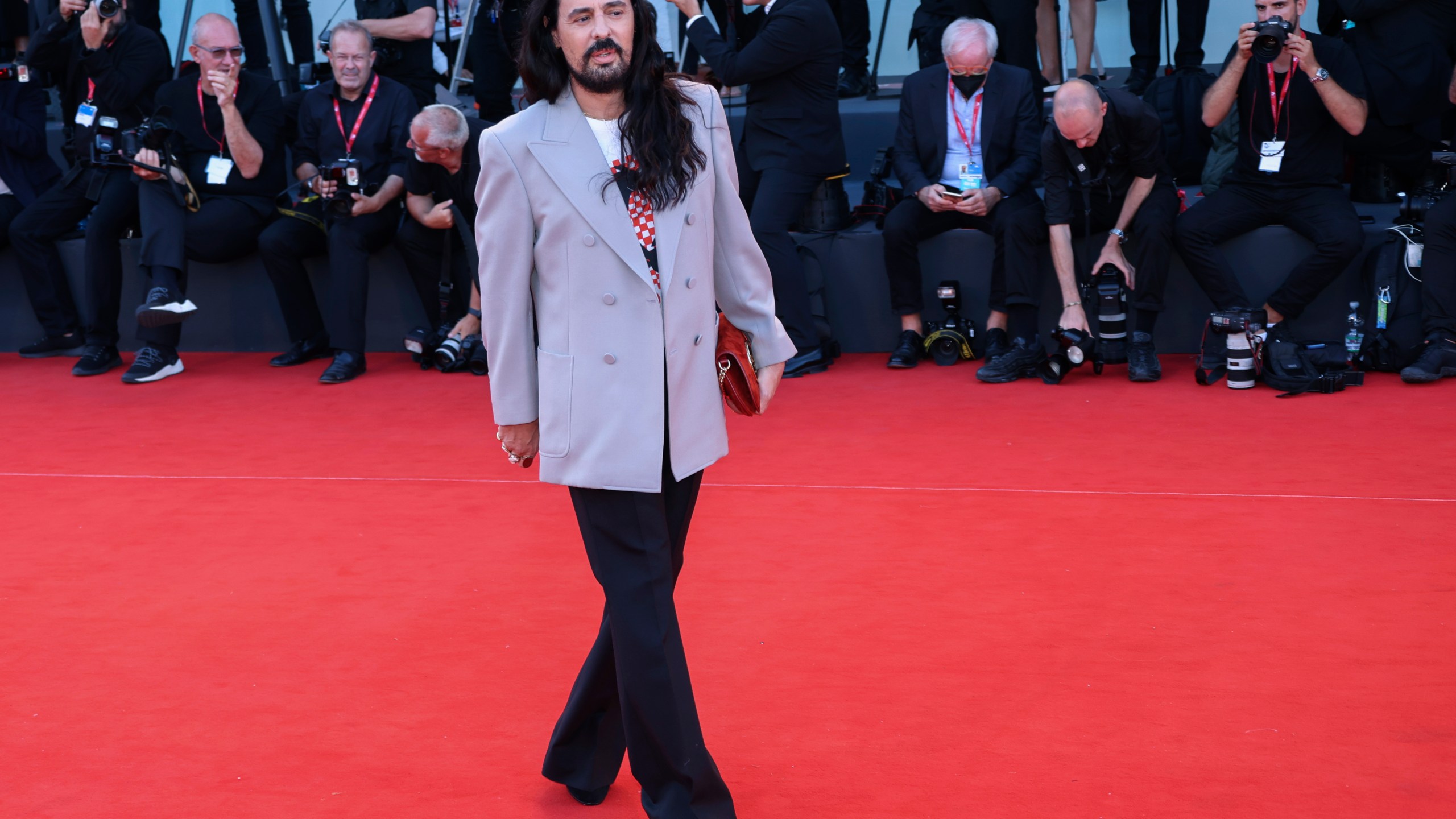 FILE - Alessandro Michele poses for photographers upon arrival at the premiere of the film 'Don't Worry Darling' during the 79th edition of the Venice Film Festival in Venice, Italy, on Sept. 5, 2022. The flamboyant former designer of Gucci Alessandro Michele has been named the new creative director at storied Roman luxury house Valentino, following the sudden departure last week of Pierpaolo Piccioli after 25 years. Valentino confirmed the move in a statement Thursday March 28, 2024. (Photo by Joel C Ryan/Invision/AP, File)