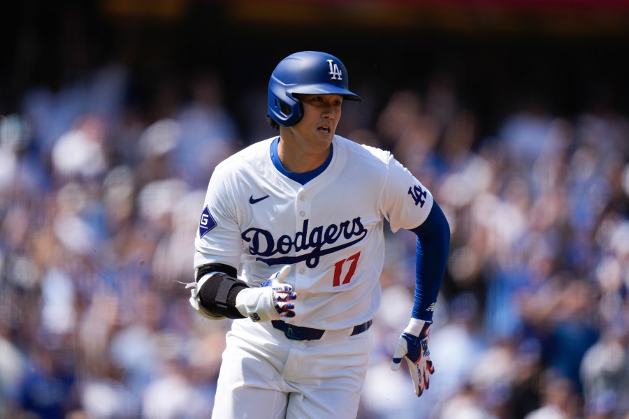 Los Angeles Dodgers' Shohei Ohtani runs to first base after hitting a double against the St. Louis Cardinals during the first inning of a baseball game Thursday, March 28, 2024, in Los Angeles. (AP Photo/Jae C. Hong)