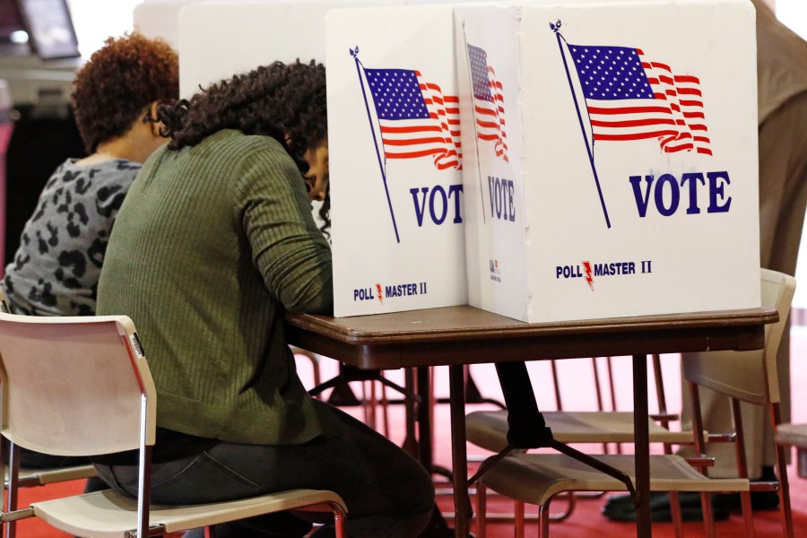 FILE - Voters work on their ballots in kiosks in Jackson, Miss., March 10, 2020. Voters in the pivotal swing state of Wisconsin, as well as Connecticut, New York and Rhode Island, will weigh in on their parties presumptive nominees in presidential primaries Tuesday, April 2, 2024. Further south, Arkansas and Mississippi voters will return to the polls to decide a small handful of legislative seats that were forced to runoffs in primaries held earlier in March. (AP Photo/Rogelio V. Solis, File)