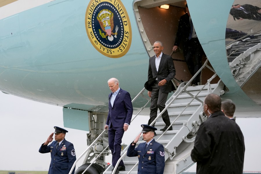 President Joe Biden, left, and former President Barack Obama exit Air Force One upon arriving at John F. Kennedy International Airport, Thursday, March 28, 2024, in New York. (AP Photo/Alex Brandon)