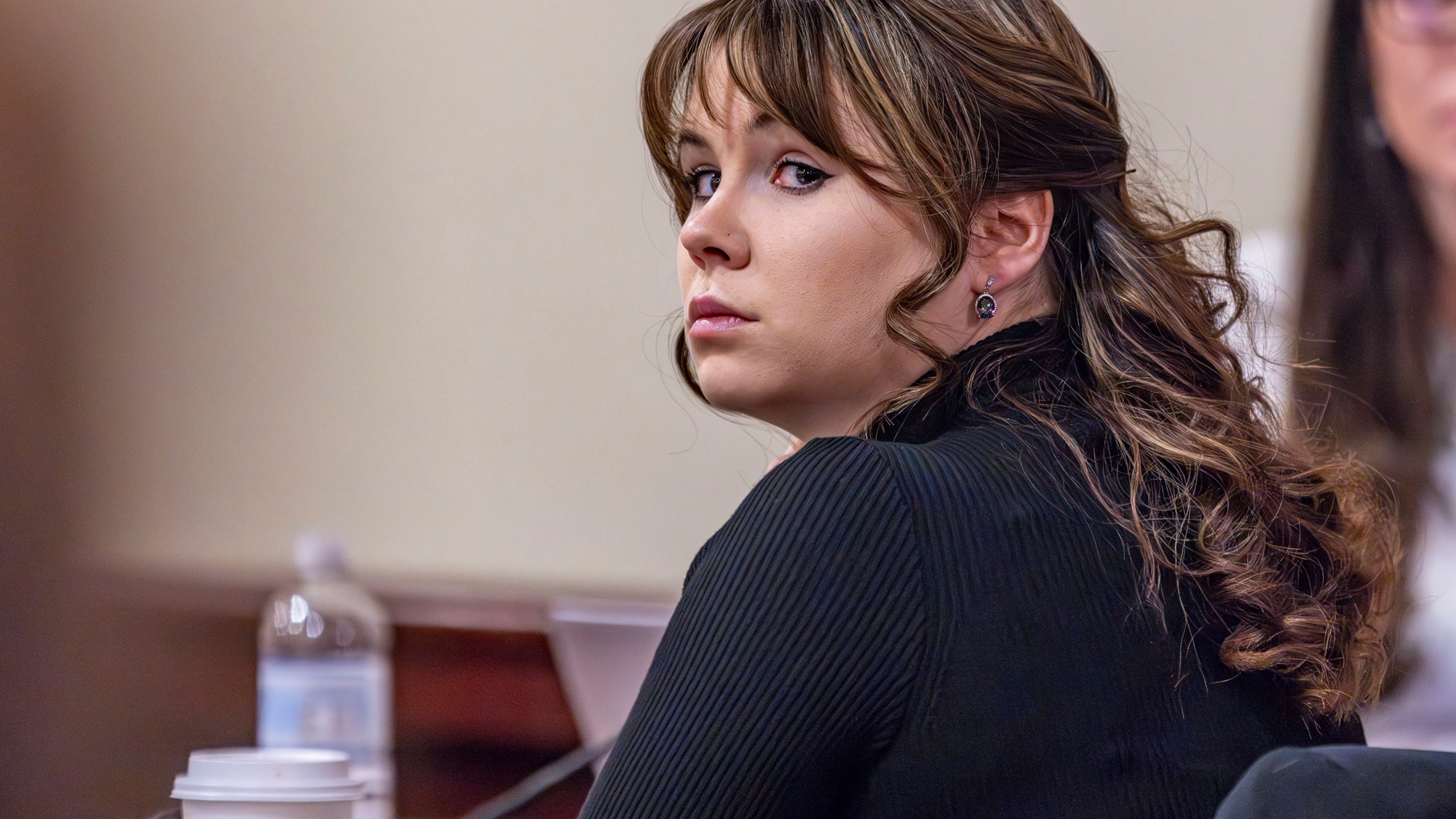 Hannah Gutierrez-Reed, the former armorer at the movie "Rust", listens to closing arguments in her trial at district court on Wednesday, March 6, 2024, in Santa Fe, N.M. (Luis Sánchez Saturno/Santa Fe New Mexican via AP, Pool)