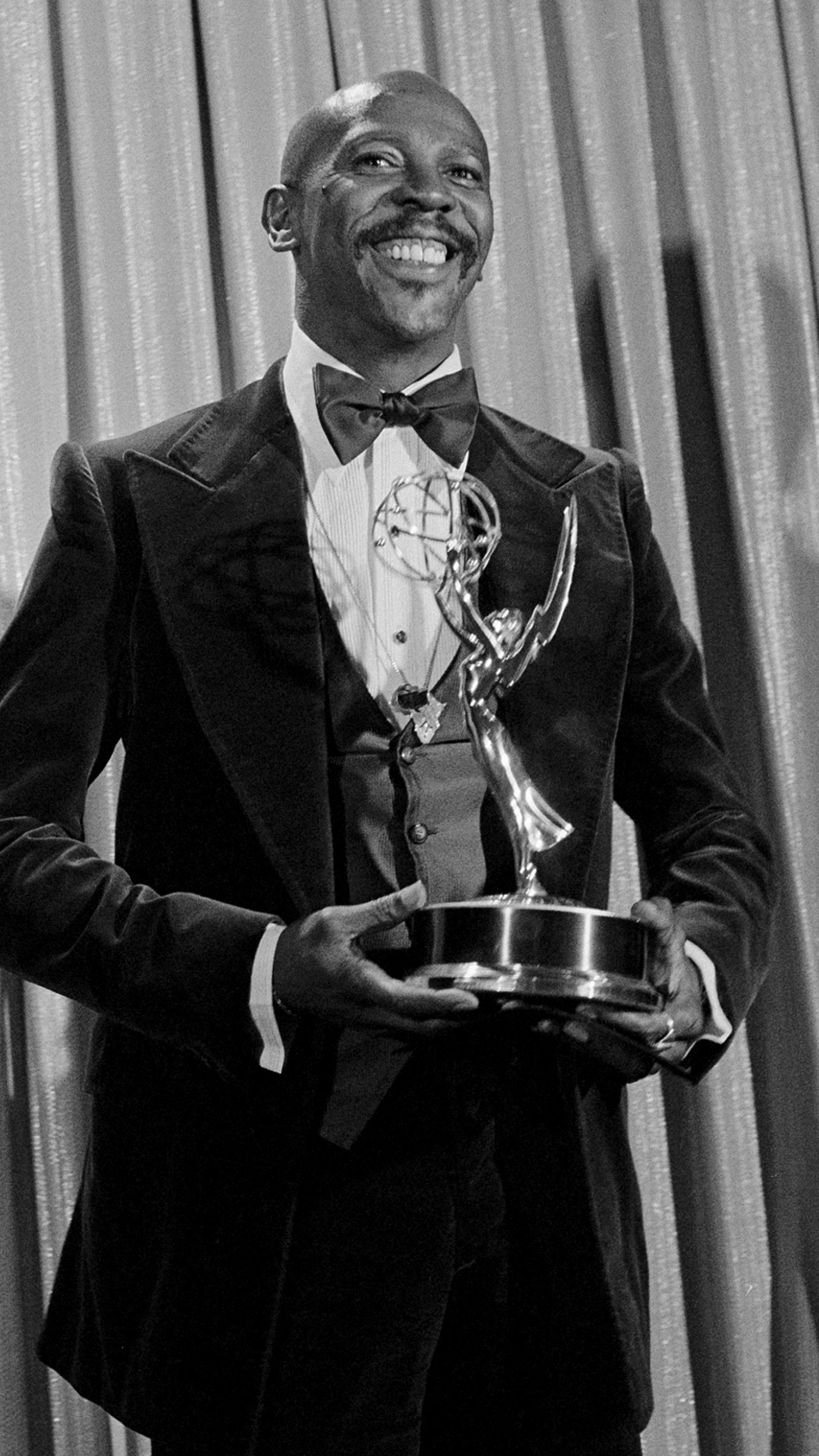 FILE - Louis Gossett Jr., poses with the Emmy he received for his role in the TV drama "Roots," at the Academy of Television, Arts and Sciences awards show in Los Angeles on Sept. 11, 1977. Gossett Jr., the first Black man to win a supporting actor Oscar and an Emmy winner for his role in the seminal TV miniseries “Roots,” has died. He was 87. (AP Photo, File)