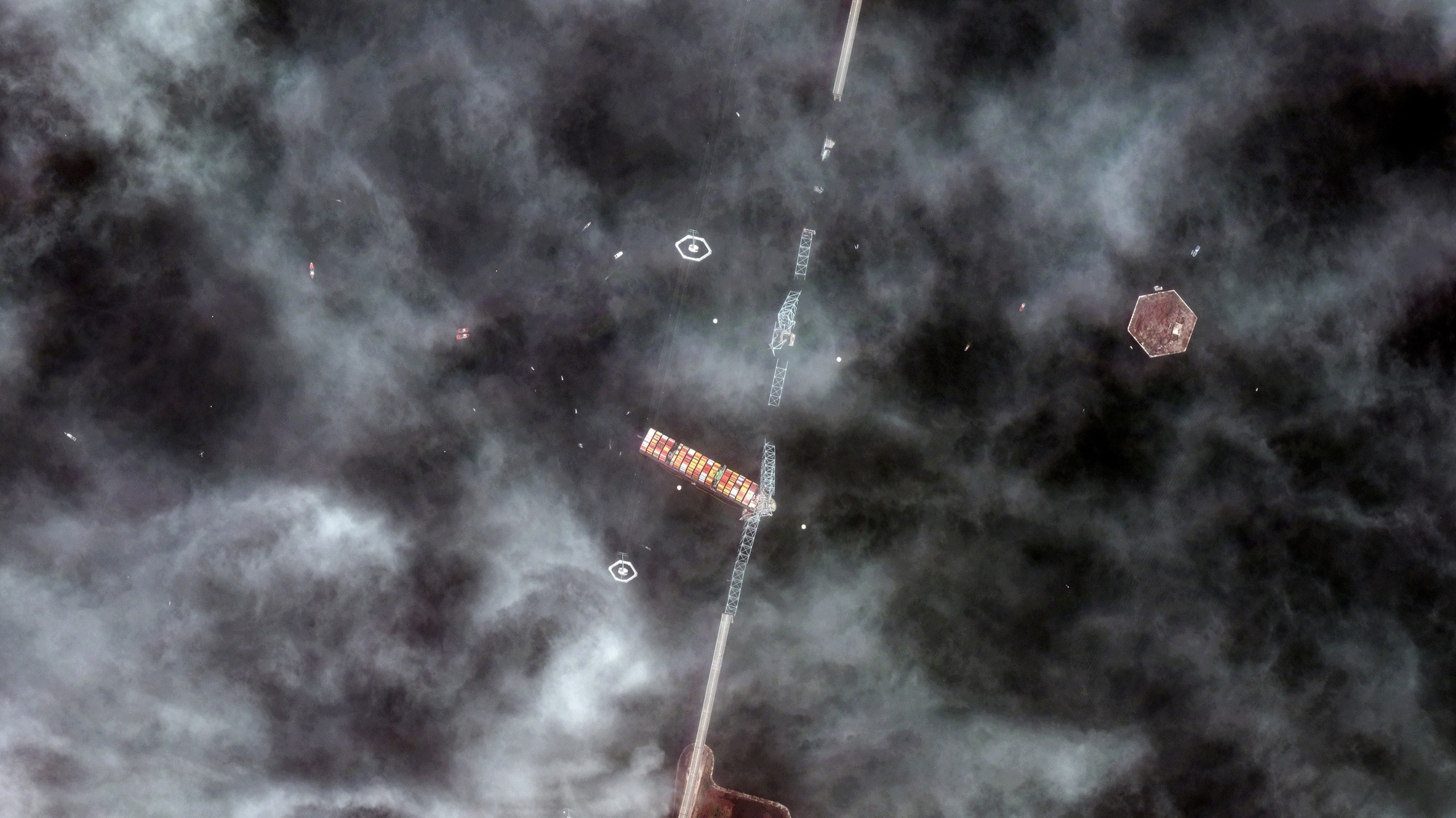 FILE - This satellite image provided by Maxar Technologies shows the Francis Scott Key Bridge struck by the container ship Dali in Baltimore, Md., on Tuesday, March 26, 2024. (Maxar Technologies via AP, File)
