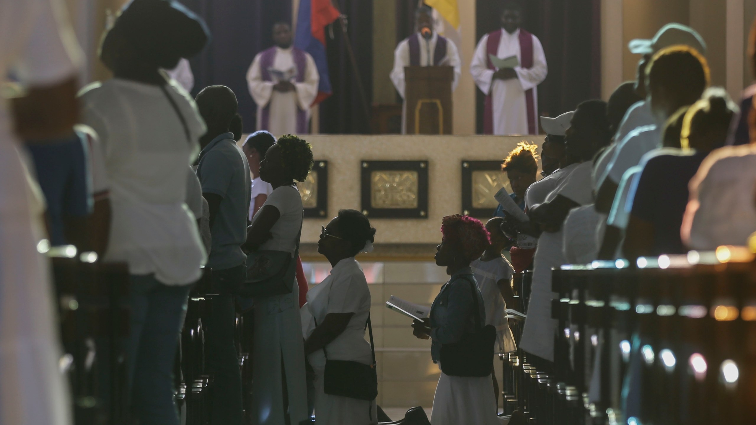 Faithful kneel in prayer during a Good Friday service as part of Holy Week celebrations, at the Saint Pierre Catholic church in the Pétion-Ville neighborhood of Port-au-Prince, Haiti, Friday, March 29, 2024. Holy Week commemorates the last week of Jesus Christ’s earthly life which culminates with his crucifixion on Good Friday and his resurrection on Easter Sunday. (AP Photo/Odelyn Joseph)