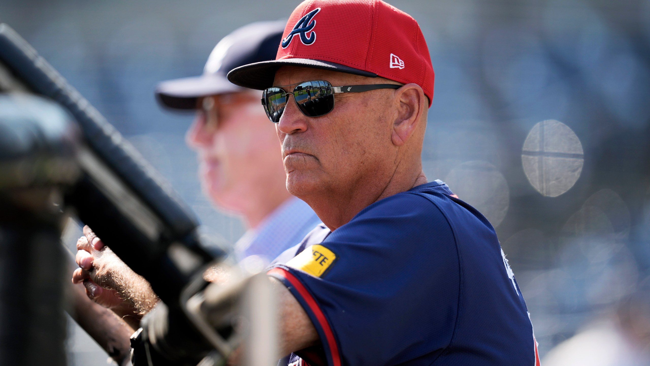 Atlanta Braves manager Brian Snitker watches batting practice before a spring training baseball game against the New York Yankees Sunday, March 10, 2024, in Tampa, Fla. (AP Photo/Charlie Neibergall)