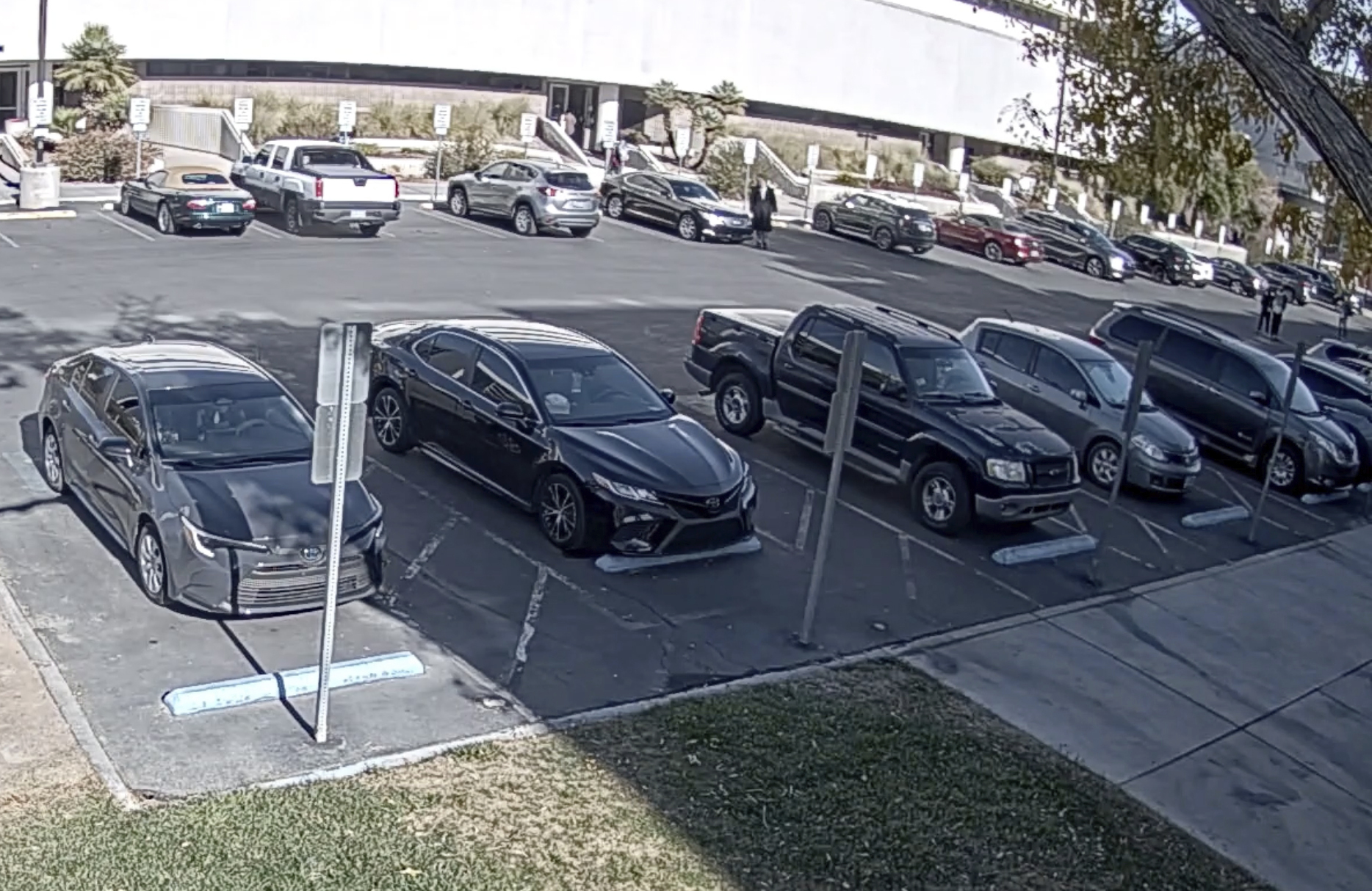 This image from campus surveillance video released by University of Nevada, Las Vegas, Thursday, March 28, 2024, shows gunman Anthony Polito, top center, getting out of his car before a deadly shooting on Dec. 6, 2023, on the campus in Las Vegas. (University of Nevada, Las Vegas via AP)
