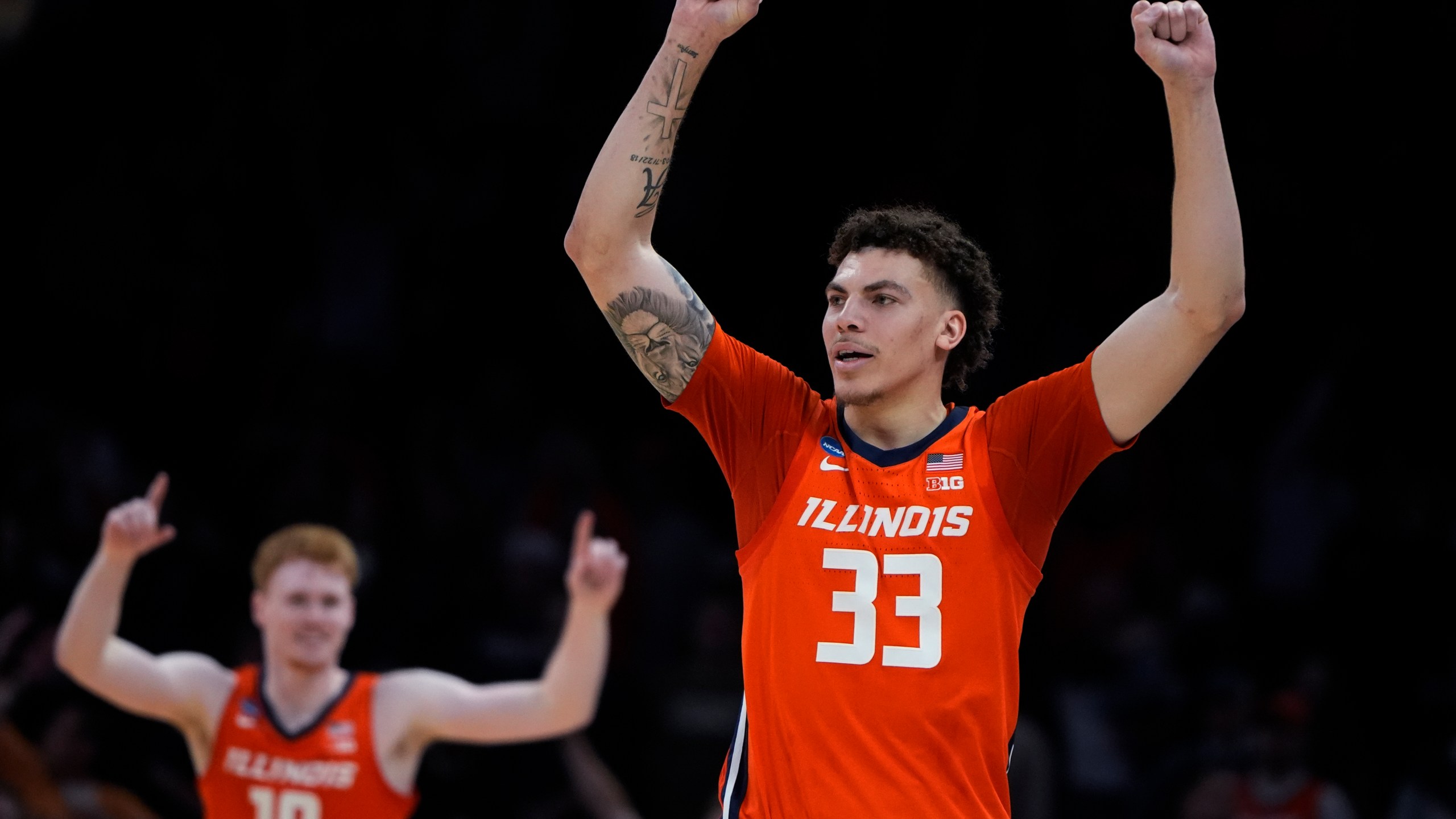 Illinois forward Coleman Hawkins (33) celebrates after defeating Iowa State following a Sweet 16 college basketball game in the men's NCAA Tournament, Friday, March 29, 2024, in Boston. (AP Photo/Michael Dwyer)