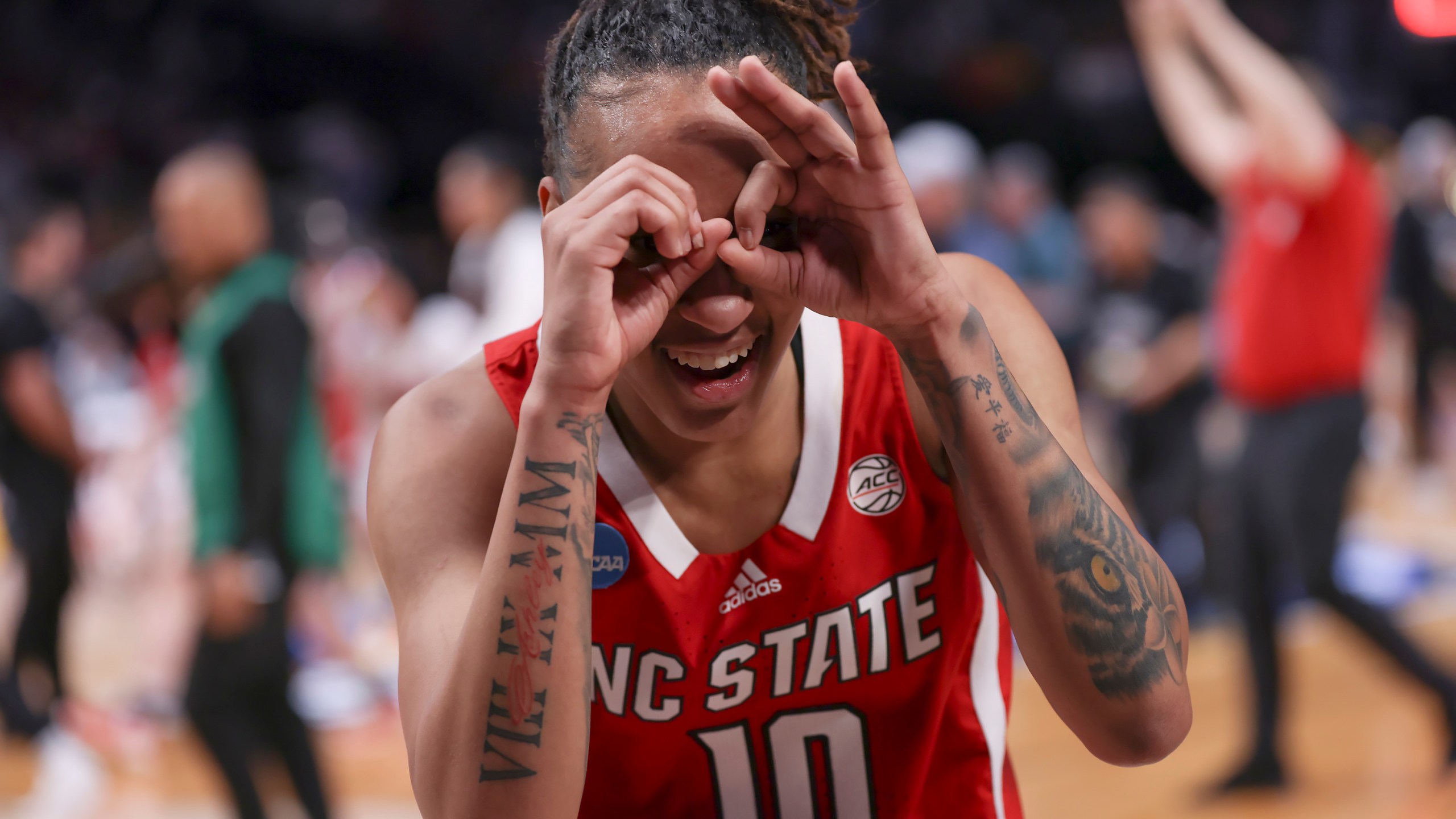 North Carolina State guard Aziaha James (10) celebrates after a Sweet 16 college basketball game against Stanford in the women's NCAA Tournament, Friday, March 29, 2024, in Portland, Ore. North Carolina State won 77-67. (AP Photo/Howard Lao)