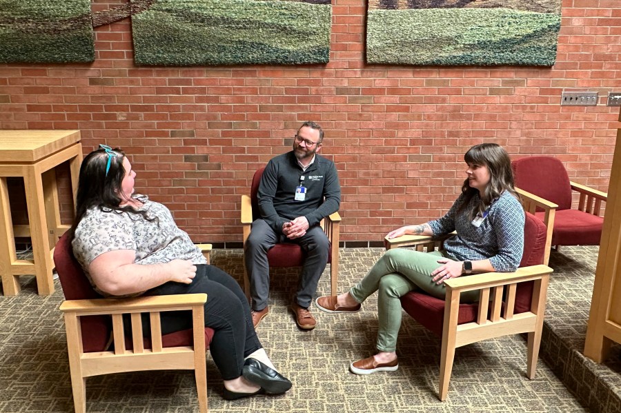 Eric Johnson, center, director of spiritual care at UnityPoint Health's Des Moines, Iowa-area hospitals, talks with other chaplains serving under his direction, on March 11, 2024. Chaplains, traditionally a clergyperson ministering outside of a congregation, have long served in the U.S., but some conservatives are hoping to introduce the role in public schools. (AP Photo/Hannah Fingerhut)