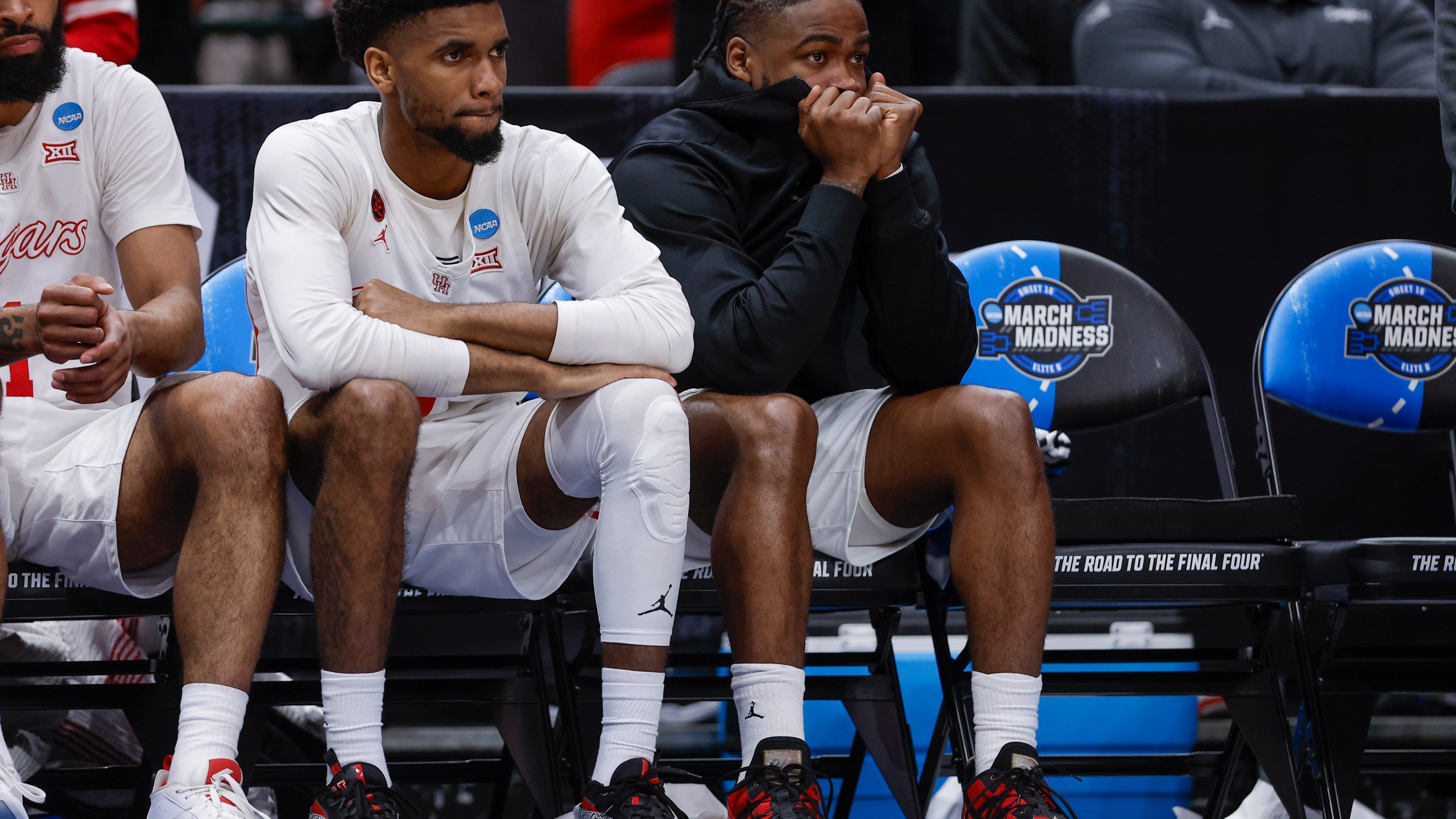 Houston's Jamal Shead, right, sits with teammates on the bench during the second half of a Sweet 16 college basketball game against Duke in the NCAA Tournament in Dallas, Friday, March 29, 2024. (AP Photo/Brandon Wade)