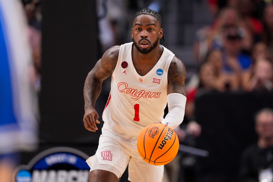 CORRECTS TO FIRST HALF INSTEAD OF SECOND HALF - Houston's Jamal Shead dribbles up the court against Duke during the first half of a Sweet 16 college basketball game in the NCAA Tournament in Dallas, Friday, March 29, 2024. (AP Photo/Tony Gutierrez)