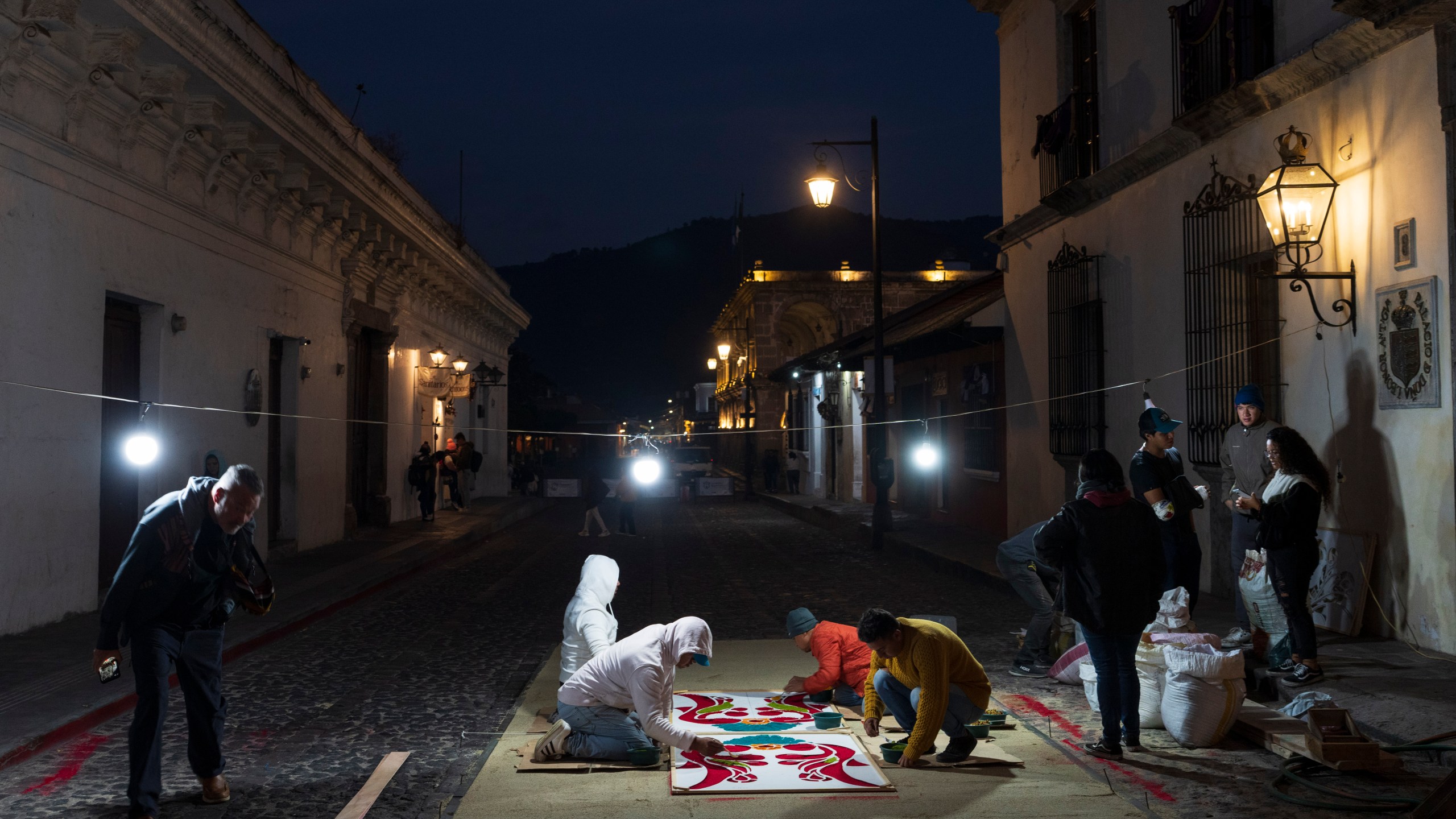 Devotees create a sawdust carpet in preparation for a Holy Week procession in Antigua, Guatemala, on Good Friday, March 29, 2024. (AP Photo/Moises Castillo)