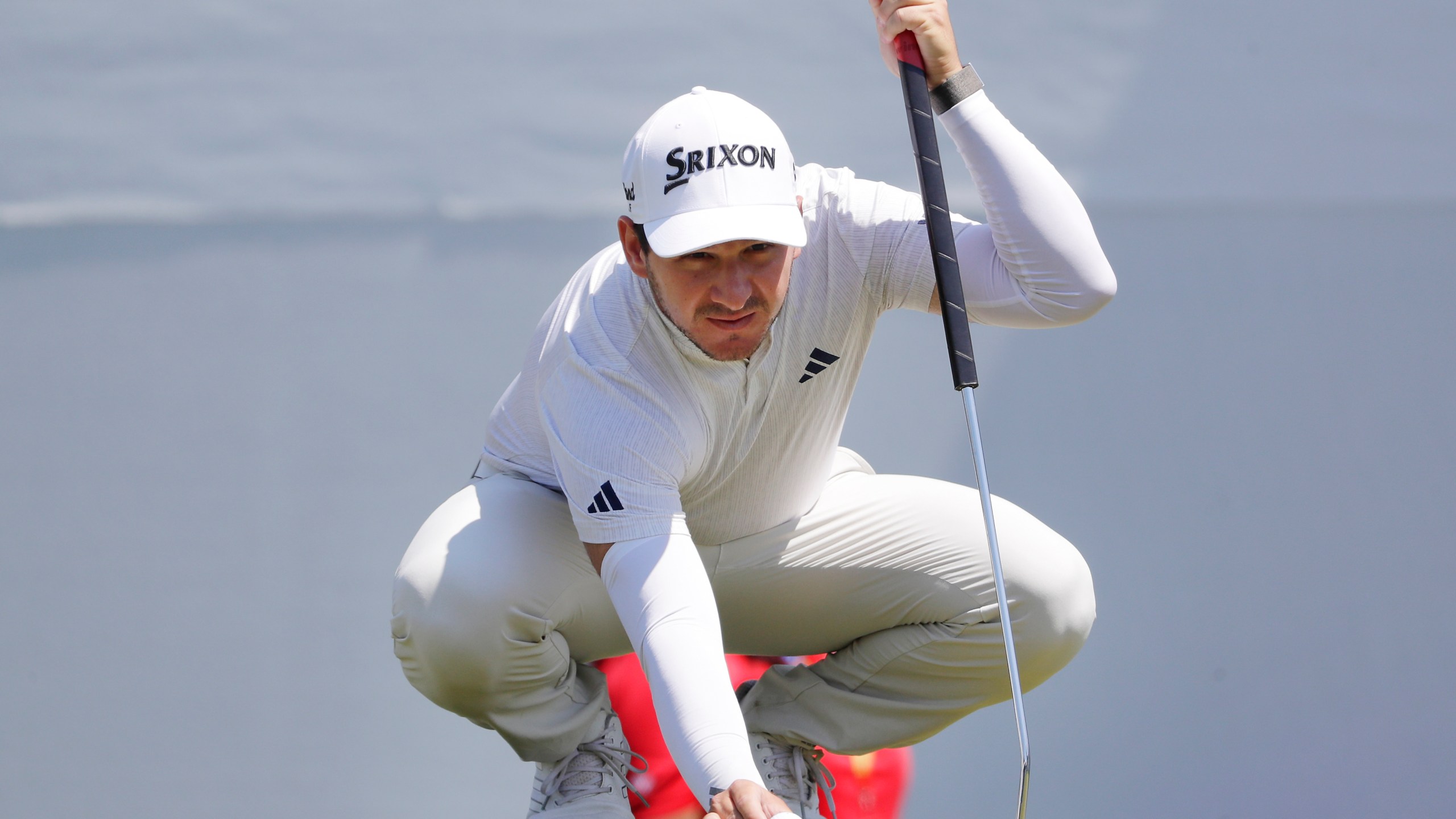 Alejandro Tosti places his ball on the 15th green before putting during the first round of the Houston Open golf tournament Thursday, March, 28, 2024, in Houston. (AP Photo/Michael Wyke)