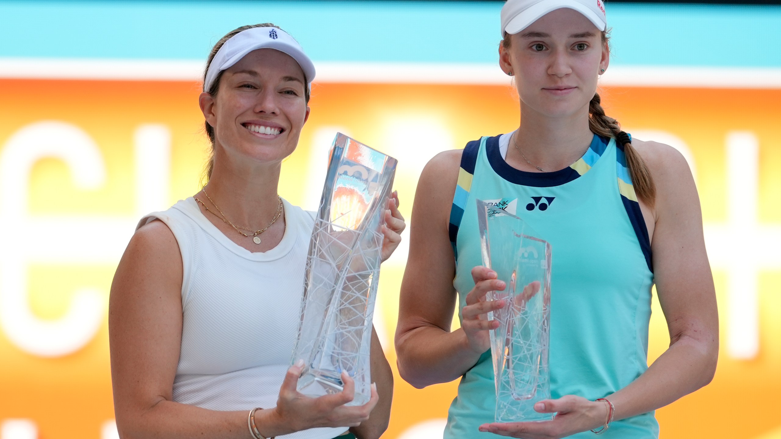Danielle Collins, left, and Elena Rybakina, of Kazakhstan, right, pose with their trophies after Collins won the women's singles final of the Miami Open tennis tournament, Saturday, March 30, 2024, in Miami Gardens, Fla. (AP Photo/Lynne Sladky)
