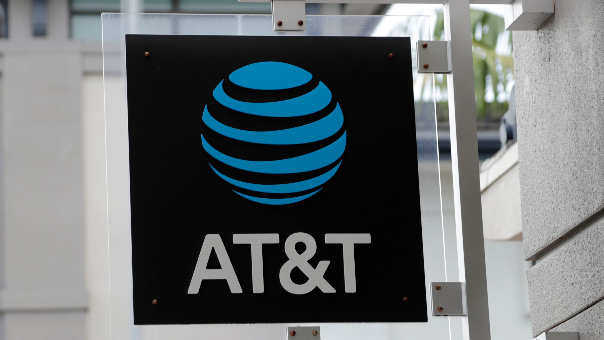 FILE - The sign in front of an AT&T retail store is seen in Miami, July 18, 2019. The theft of sensitive information belonging to millions of AT&T’s current and former customers has been recently discovered online, the telecommunications giant said Saturday, March 30, 2024. In an announcement addressing the data breach, AT&T said that a dataset found on the dark web contains information including some Social Security numbers and passcodes for about 7.6 million current account holders and 65.4 million former account holders. (AP Photo/Lynne Sladky, File)