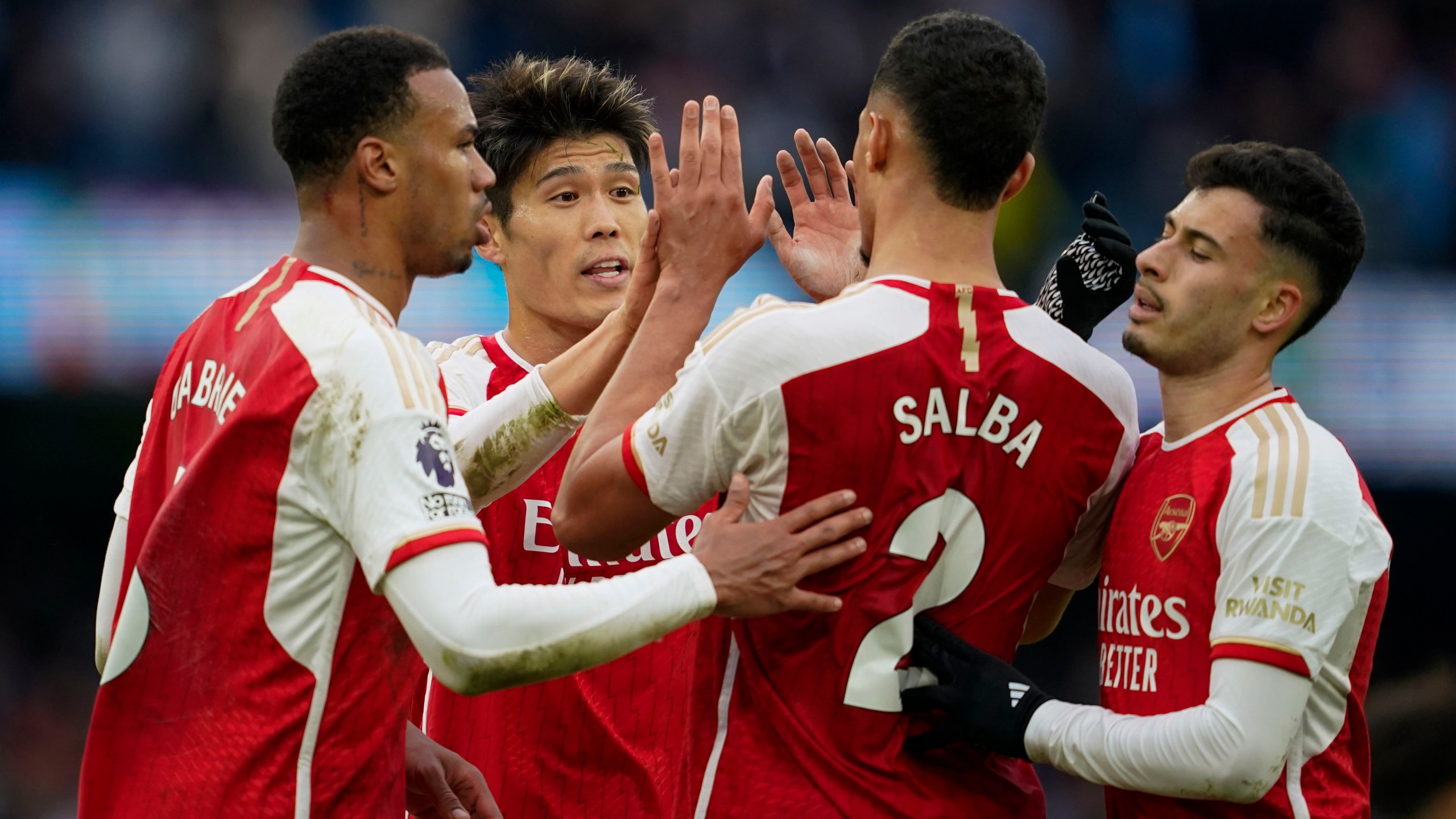 Arsenal celebrate at the end of the English Premier League soccer match between Manchester City and Arsenal at the Etihad stadium in Manchester, England, Sunday, March 31, 2024. (AP Photo/Dave Thompson)