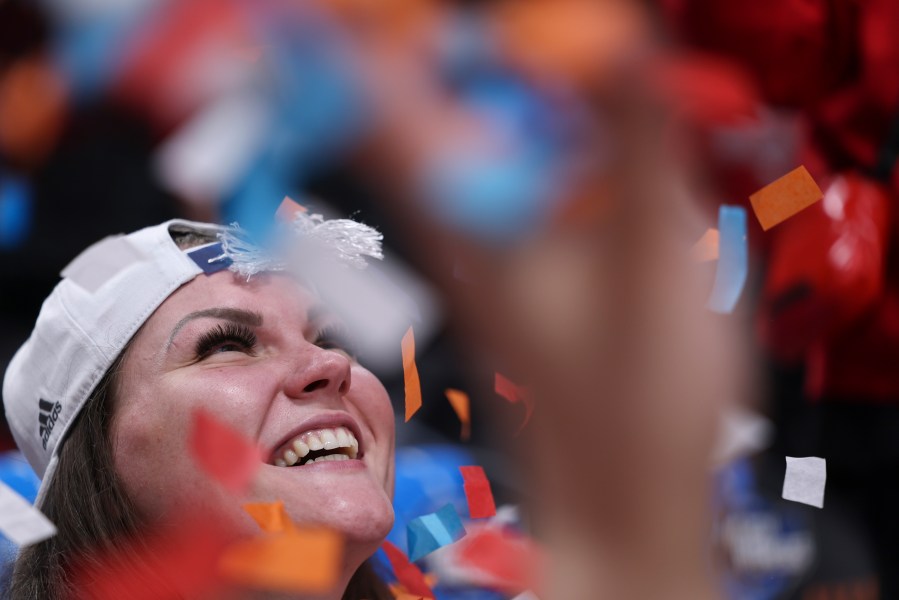 North Carolina State center River Baldwin smiles as teammates throw confetti after their win against Texas in an Elite Eight college basketball game in the women's NCAA Tournament, Sunday, March 31, 2024, in Portland, Ore. North Carolina State won 76-66. (AP Photo/Howard Lao)