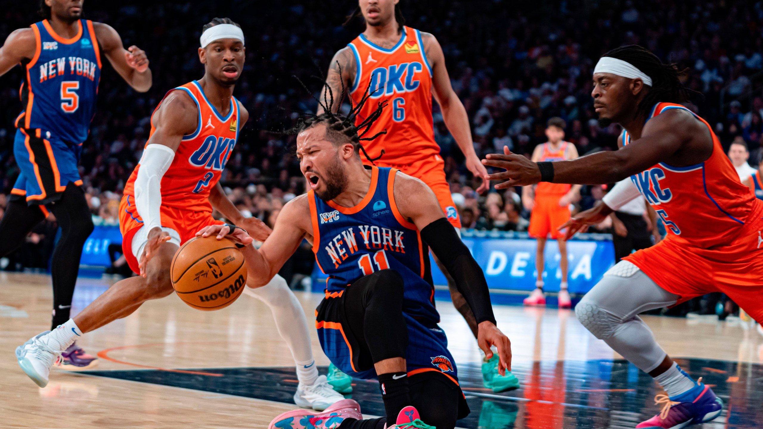 New York Knicks' Jalen Brunson (11) falls while dribbling during the first half of an NBA basketball game against the Oklahoma City Thunder in New York, Sunday, March 31, 2024. (AP Photo/Peter K. Afriyie)