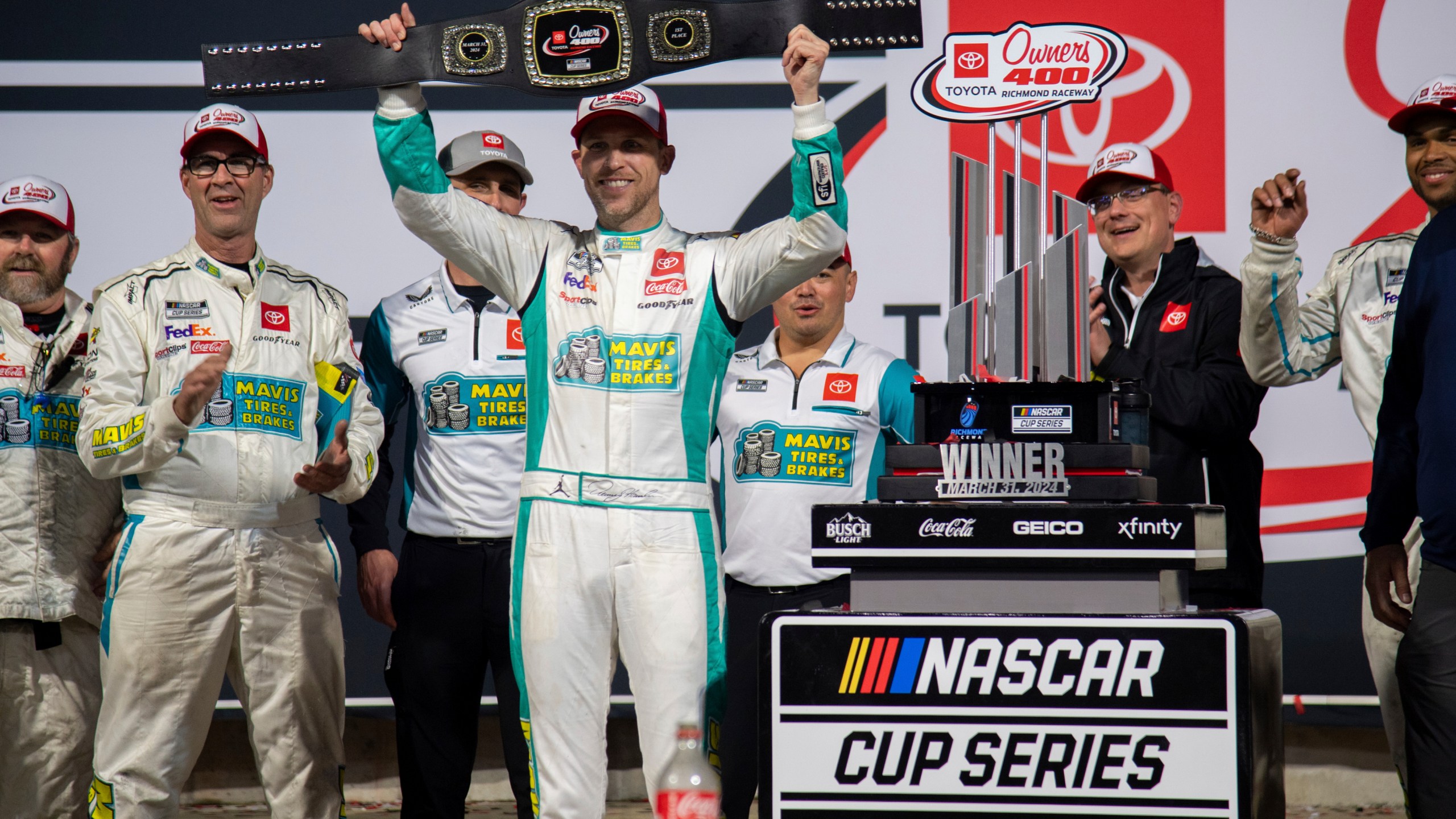 Denny Hamlin celebrates after winning a NASCAR Cup Series auto race at Richmond Raceway on Sunday, March 31, 2024, in Richmond, Va. (AP Photo/Mike Caudill)
